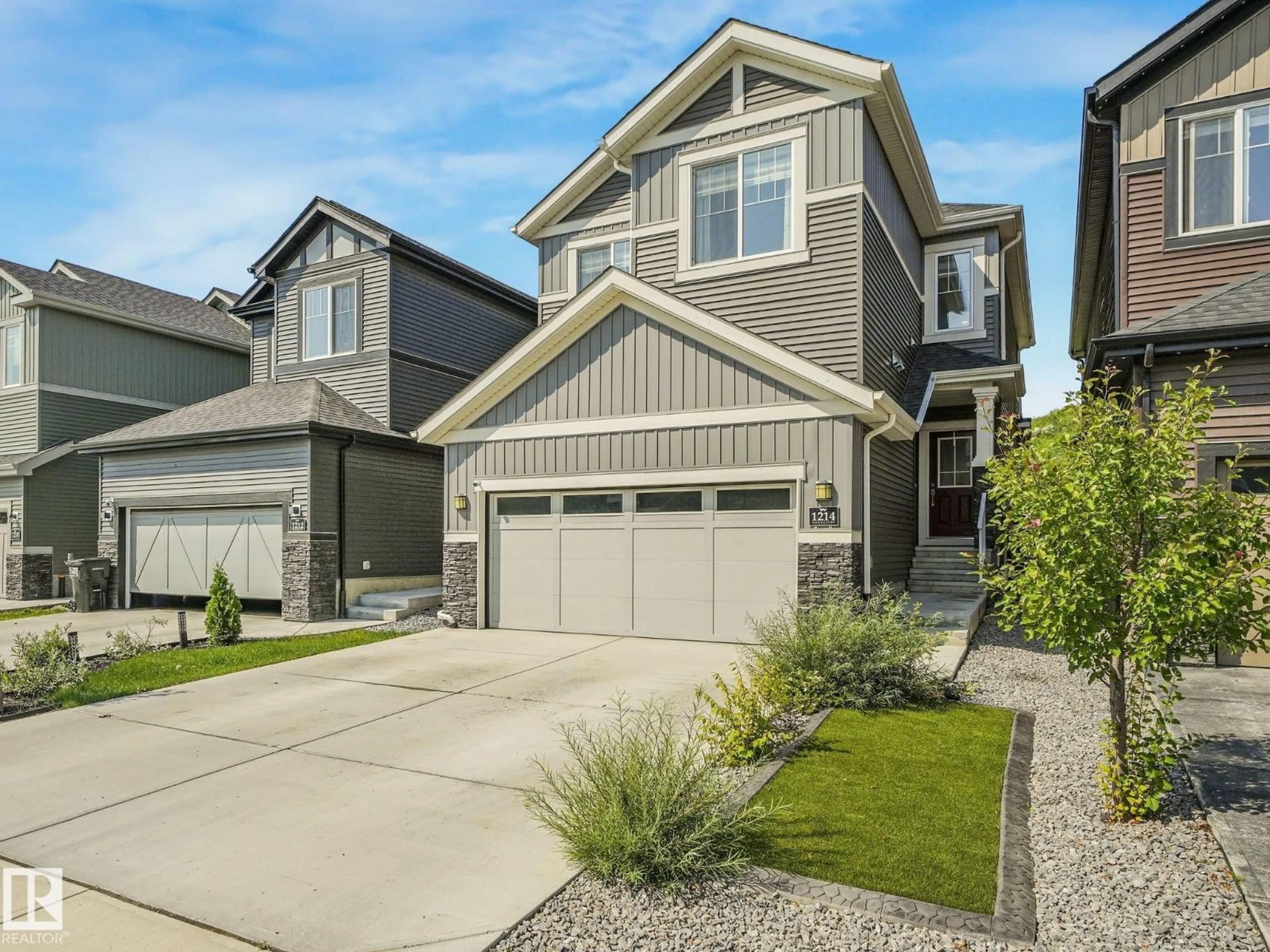 Home with vinyl exterior material, street for 1214 EATON LN, Edmonton Alberta T6M1M9