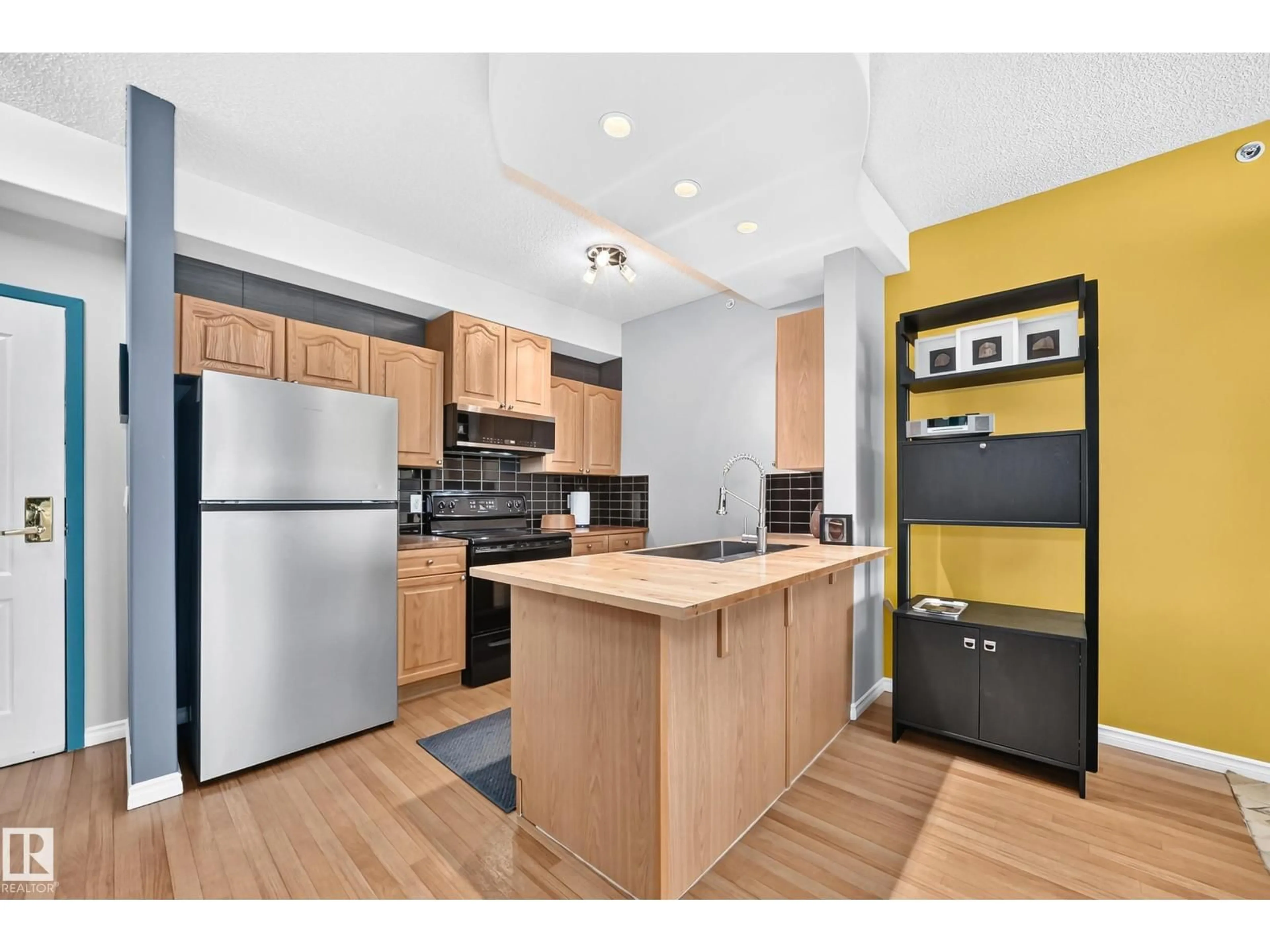 Open concept kitchen, wood/laminate floor for 421 14259 50 ST, Edmonton Alberta T5A5J2
