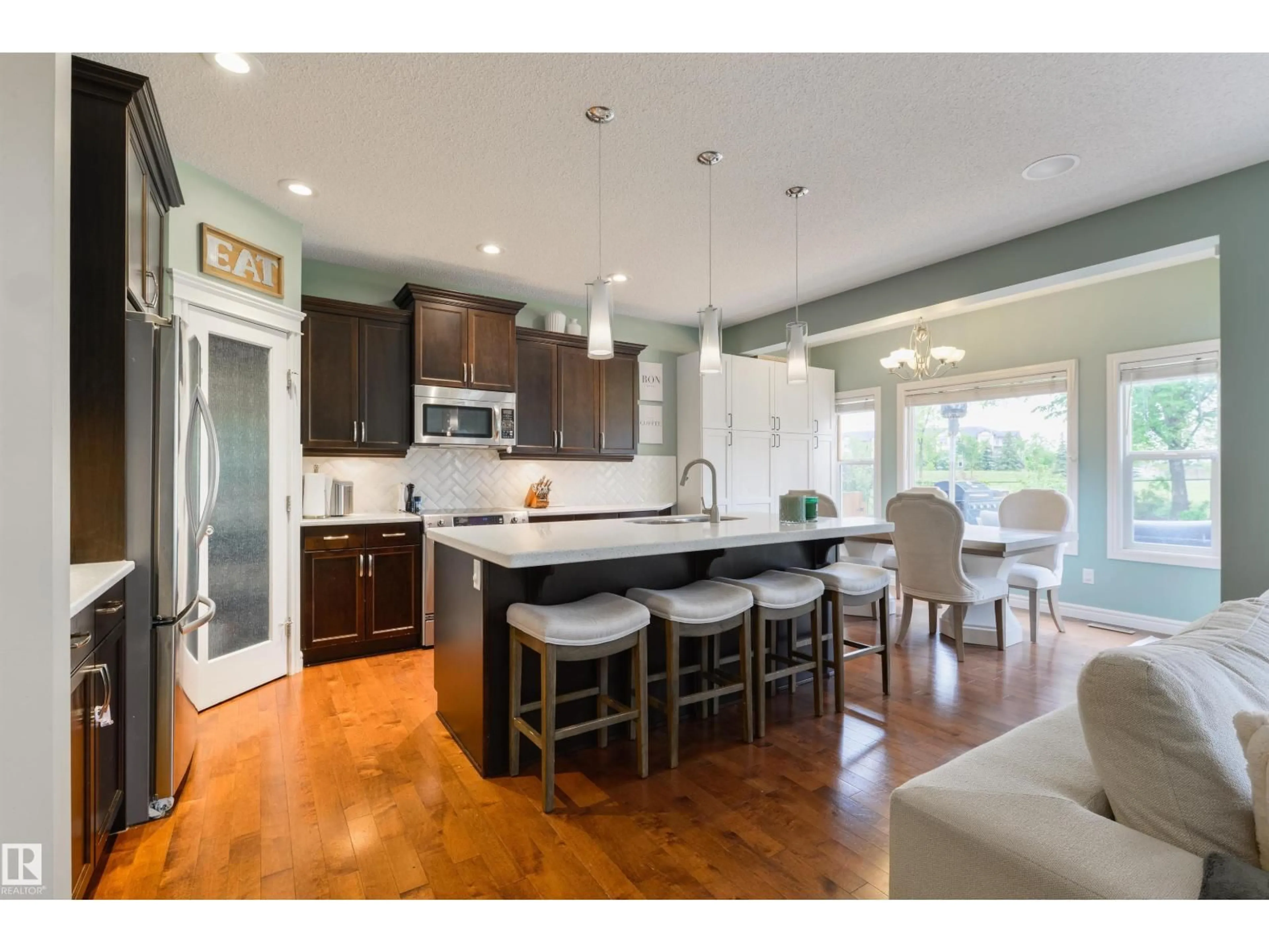Open concept kitchen, wood/laminate floor for 1375 113 ST, Edmonton Alberta T6W0N6