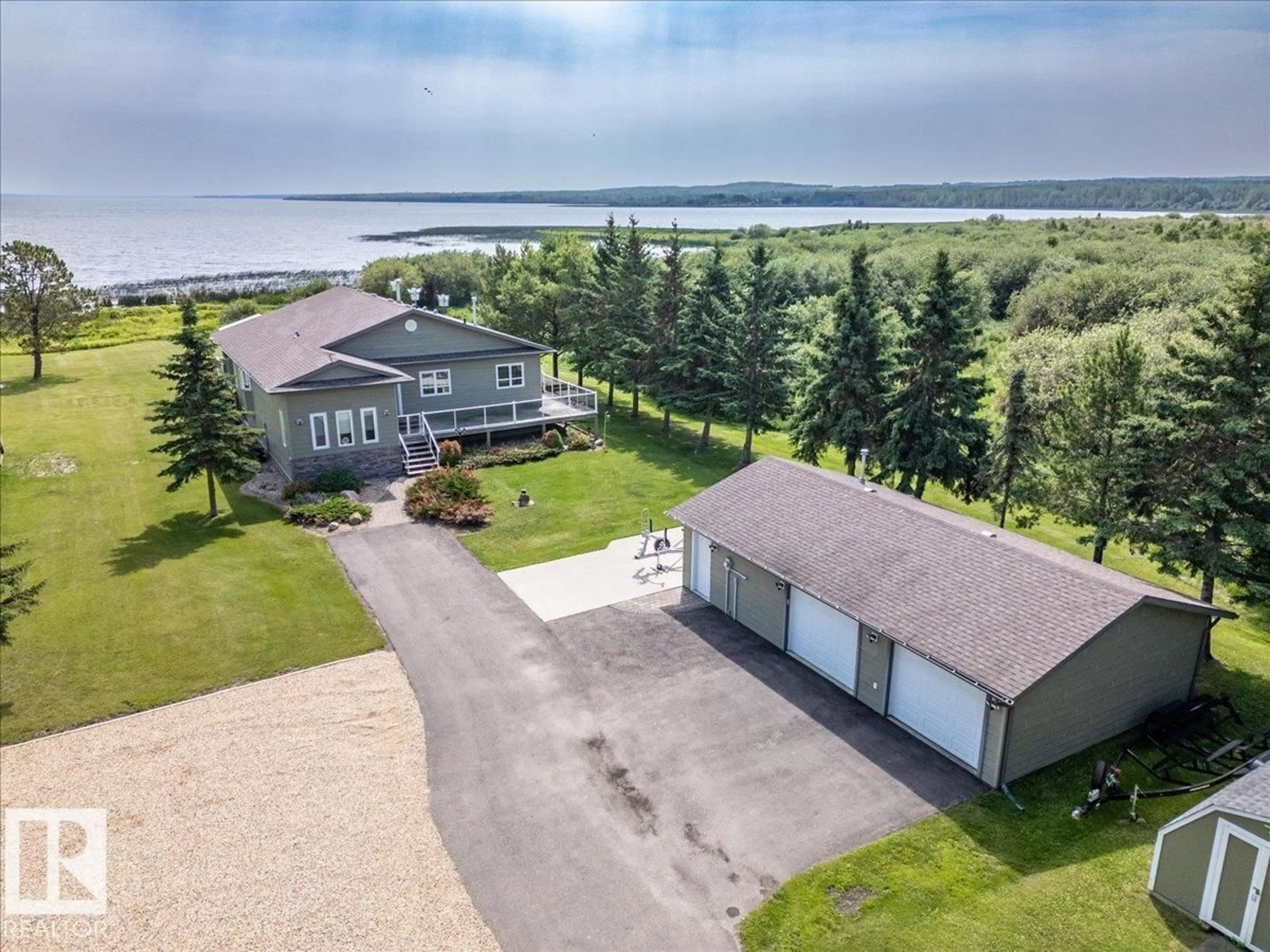A pic from outside/outdoor area/front of a property/back of a property/a pic from drone, water/lake/river/ocean view for 47257 HWY 771, Rural Leduc County Alberta T0C2C0
