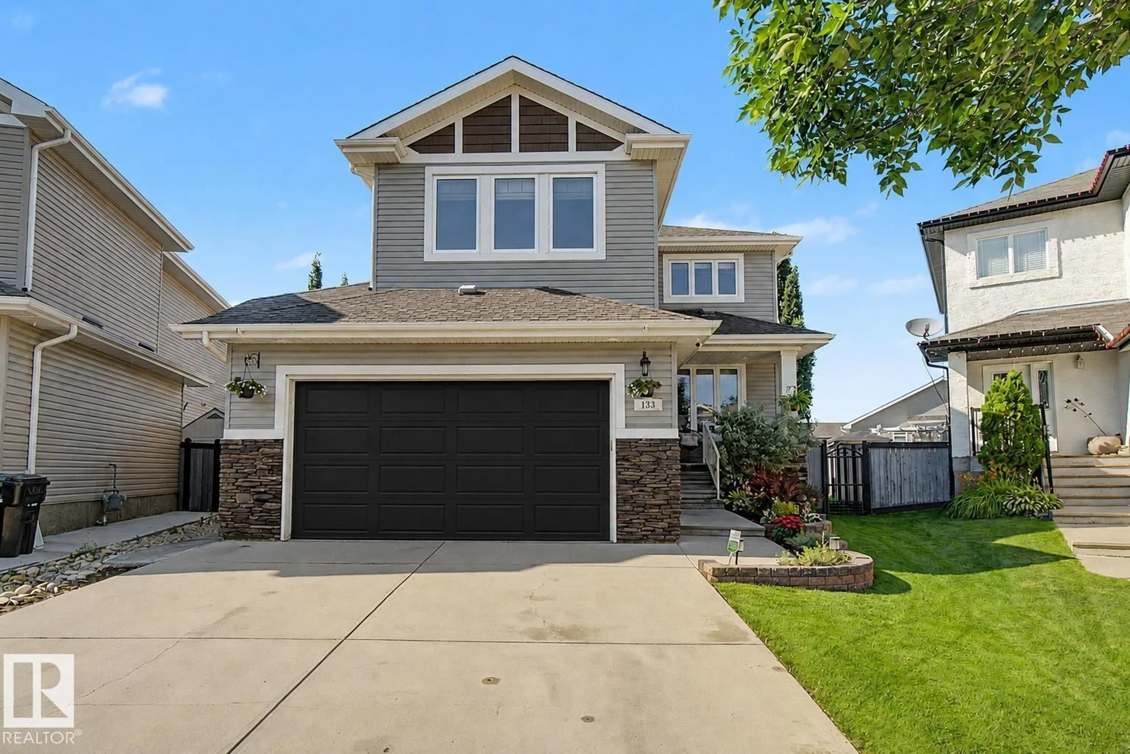 Home with vinyl exterior material, street for 133 BRIDGEPORT, Leduc Alberta T9E0M2