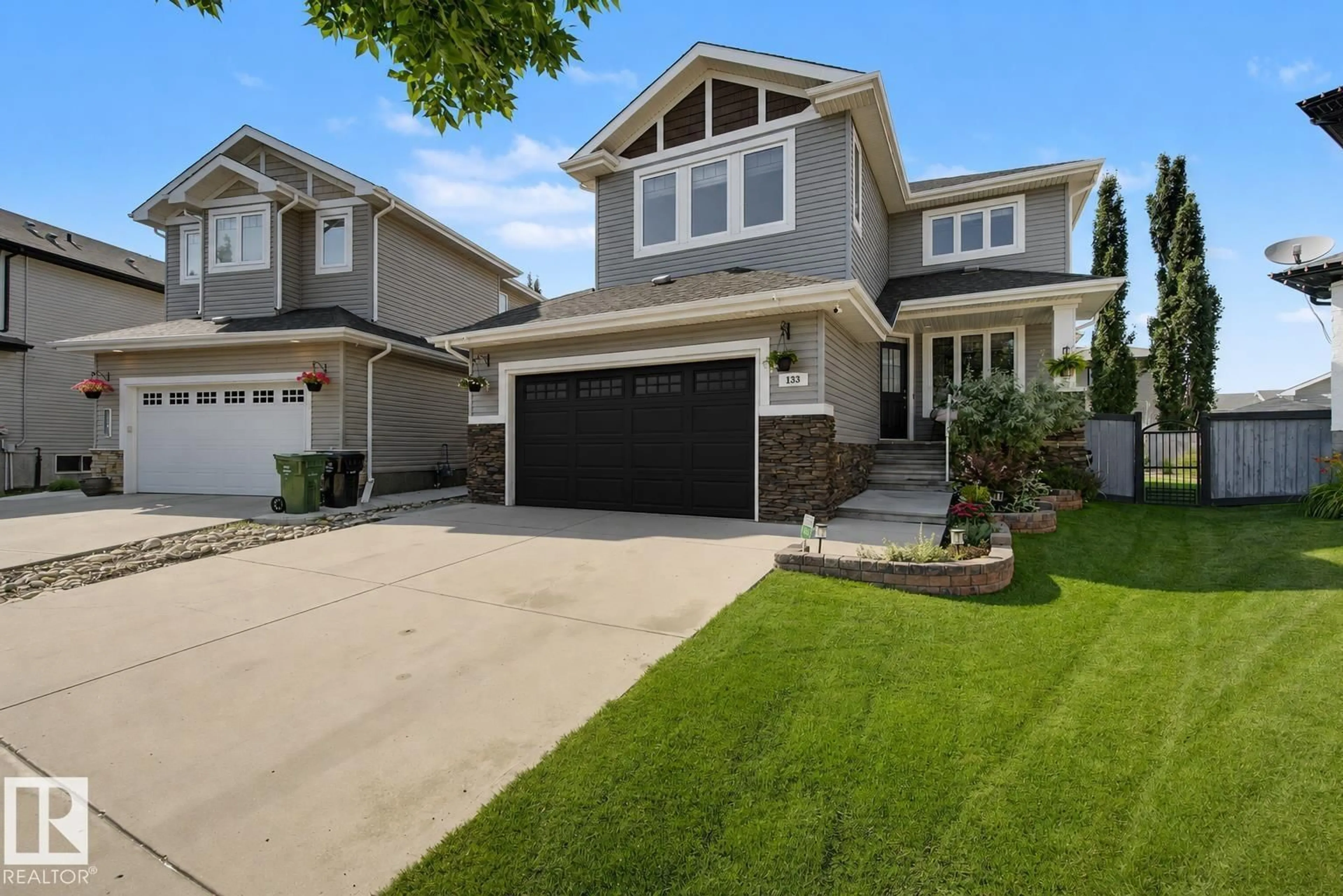 Home with vinyl exterior material, street for 133 BRIDGEPORT, Leduc Alberta T9E0M2