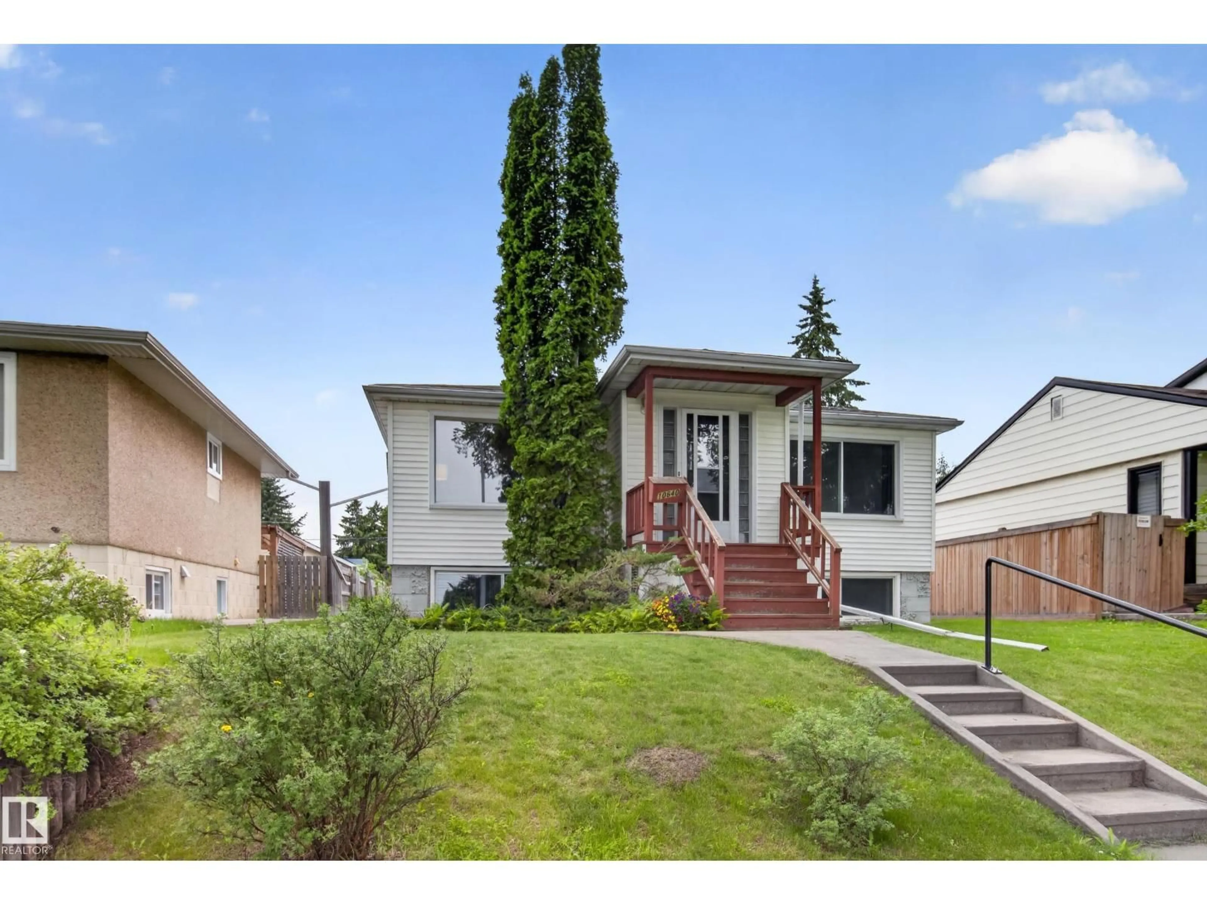 Home with vinyl exterior material, street for NW - 10640 79 ST, Edmonton Alberta T6A3H4