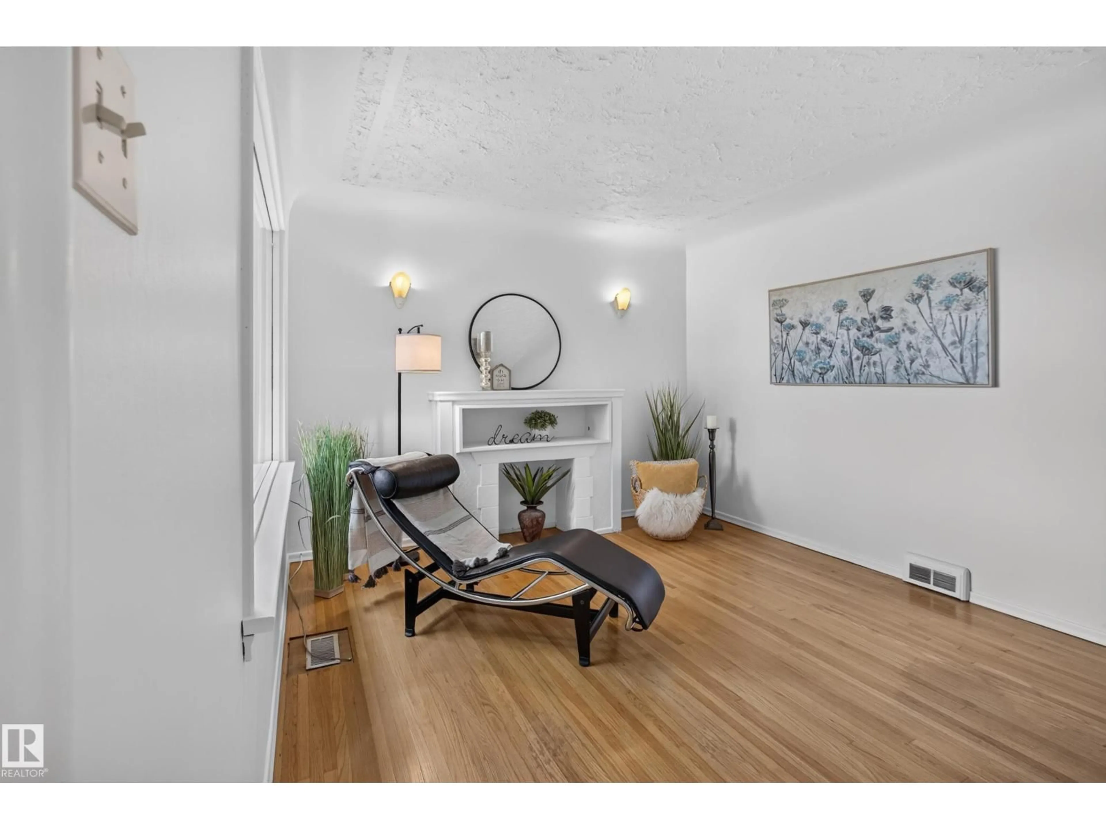 Living room with furniture, wood/laminate floor for NW - 10640 79 ST, Edmonton Alberta T6A3H4
