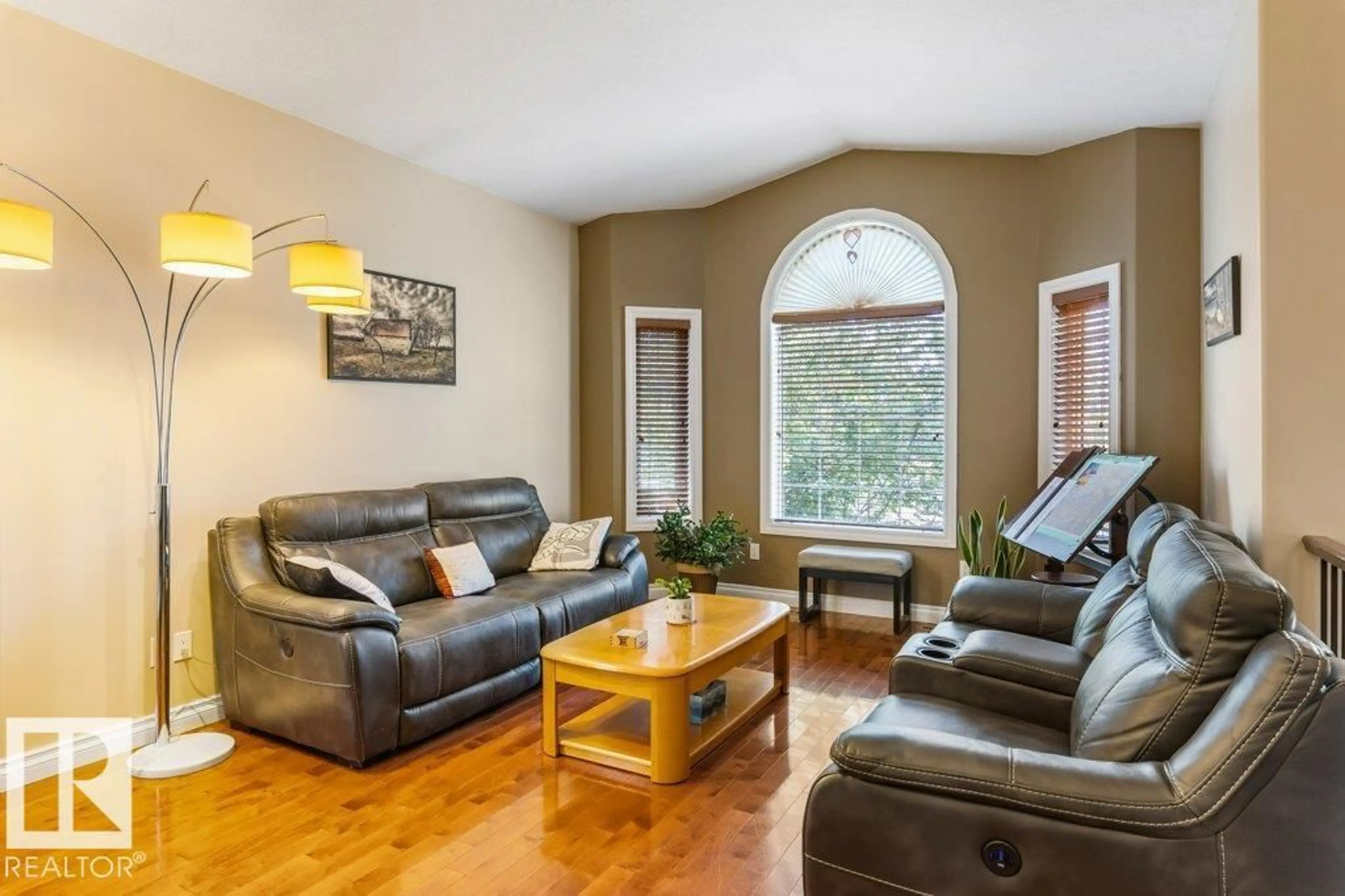 Living room with furniture, wood/laminate floor for 10107 97 ST, Morinville Alberta T8R0C8