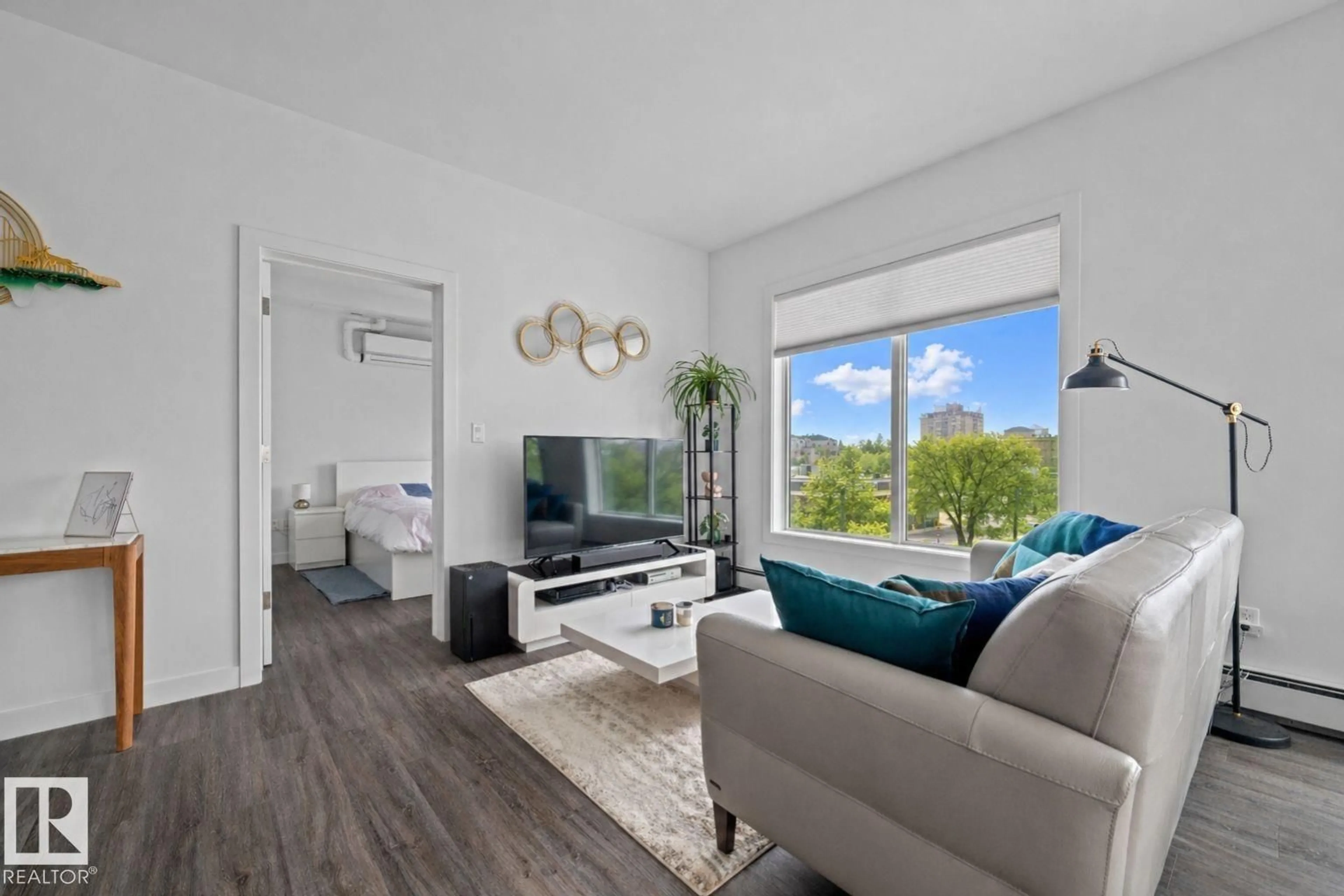 Living room with furniture, wood/laminate floor for #408 - 10837 83 AV, Edmonton Alberta T6E2E6