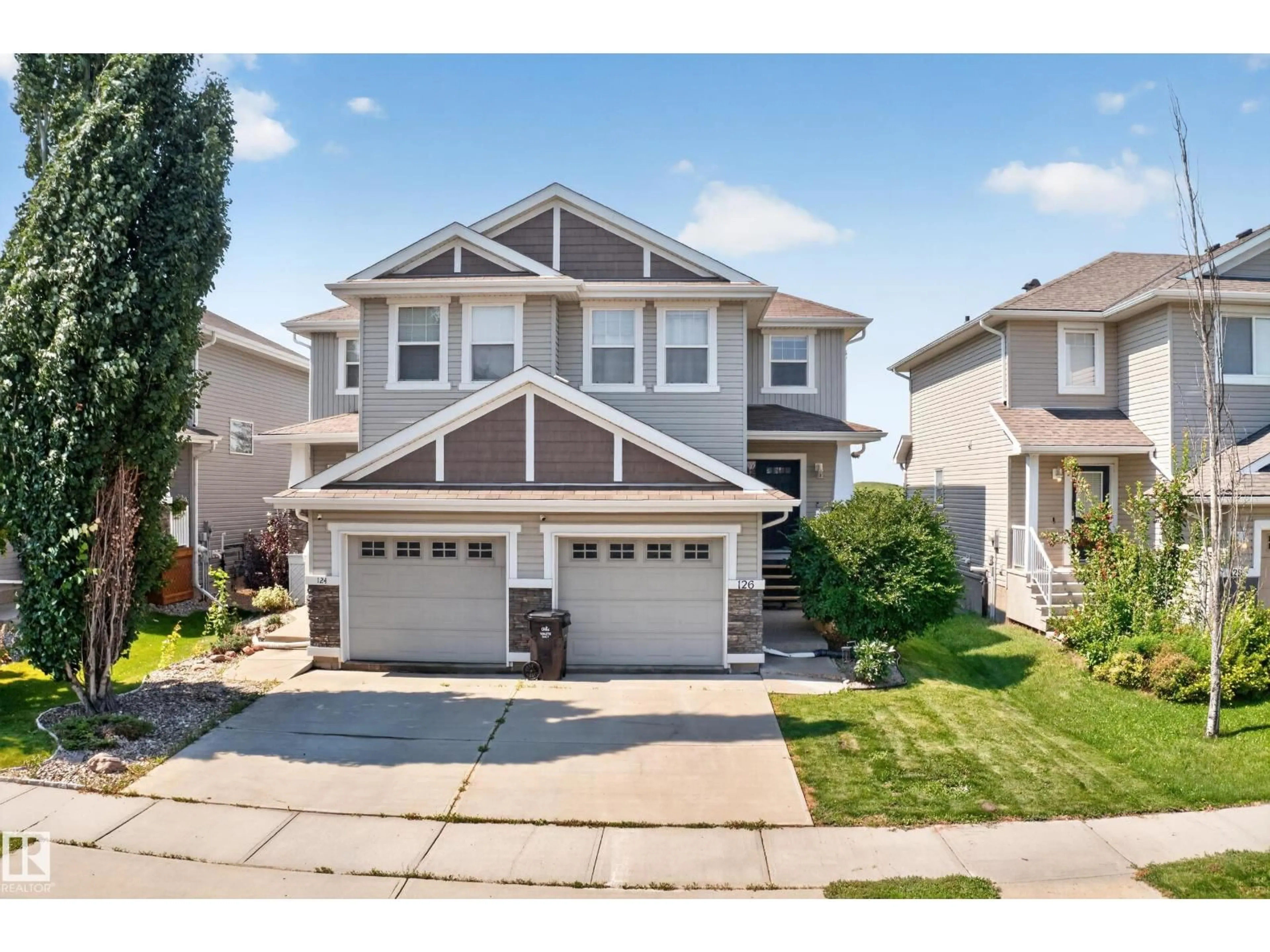Home with vinyl exterior material, street for 124 KEYSTONE CR, Leduc Alberta T9E0M6