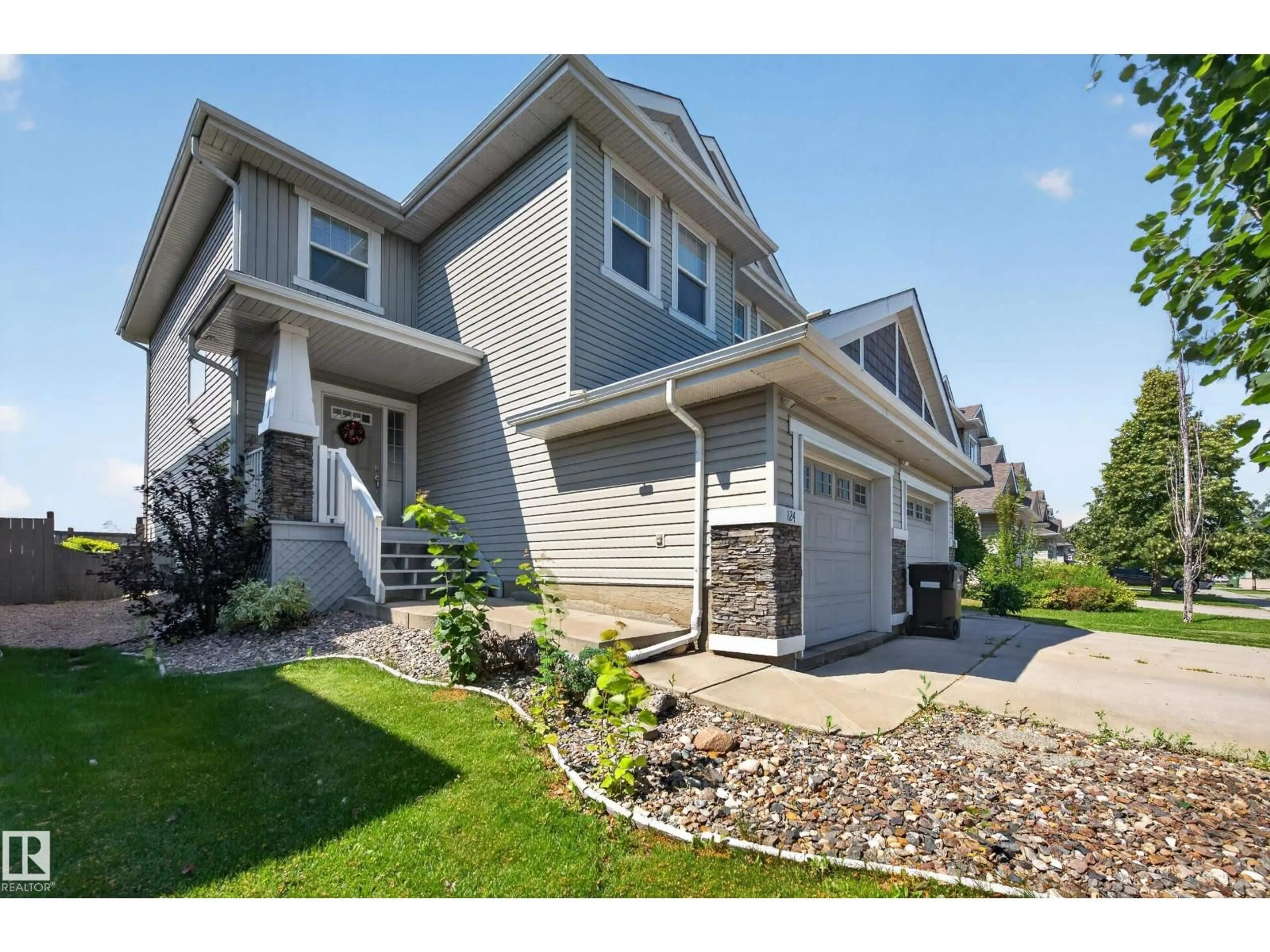 Home with vinyl exterior material, street for 124 KEYSTONE CR, Leduc Alberta T9E0M6