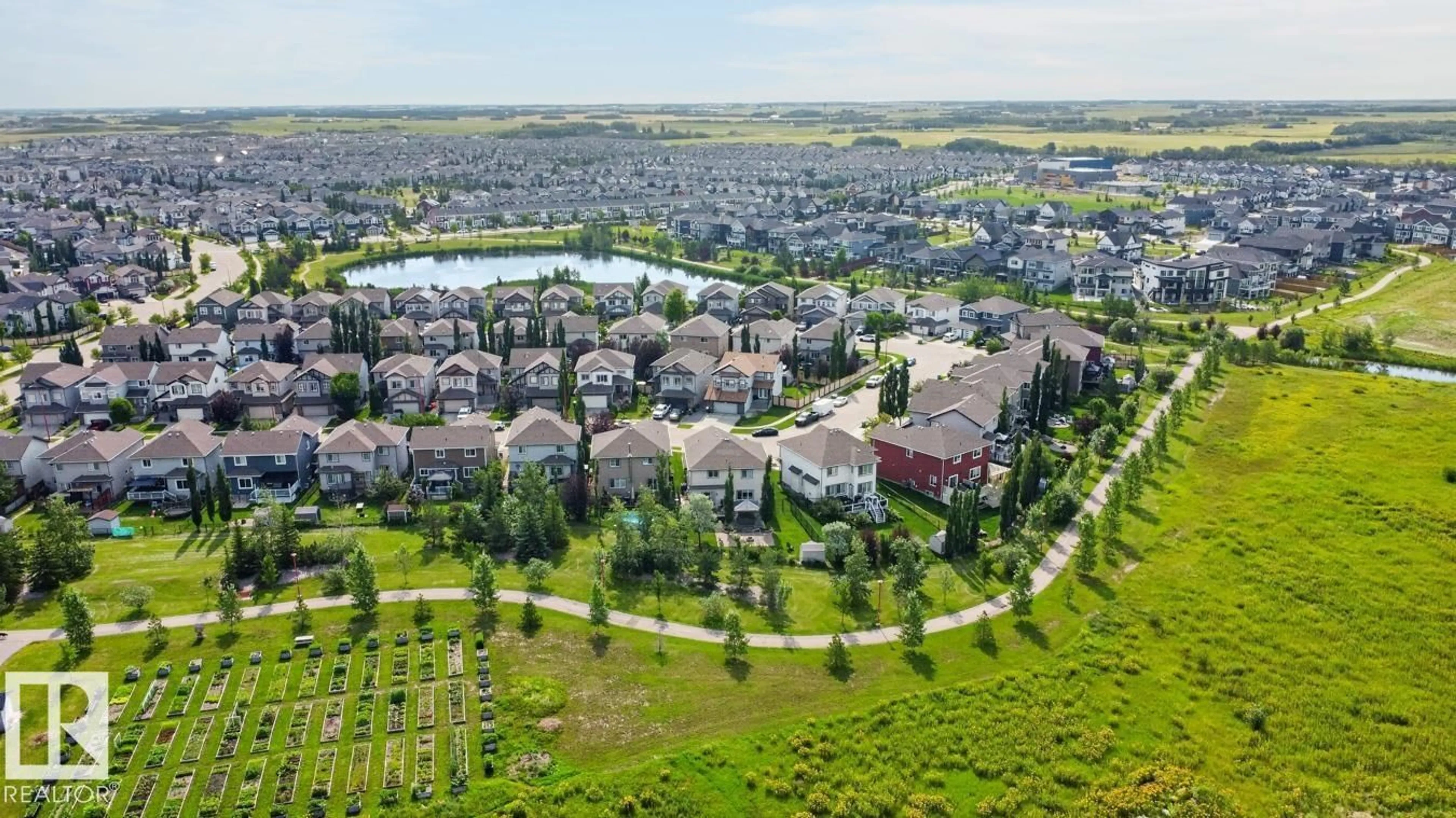 A pic from outside/outdoor area/front of a property/back of a property/a pic from drone, water/lake/river/ocean view for 817 SOUTHFORK GR, Leduc Alberta T9E0P4
