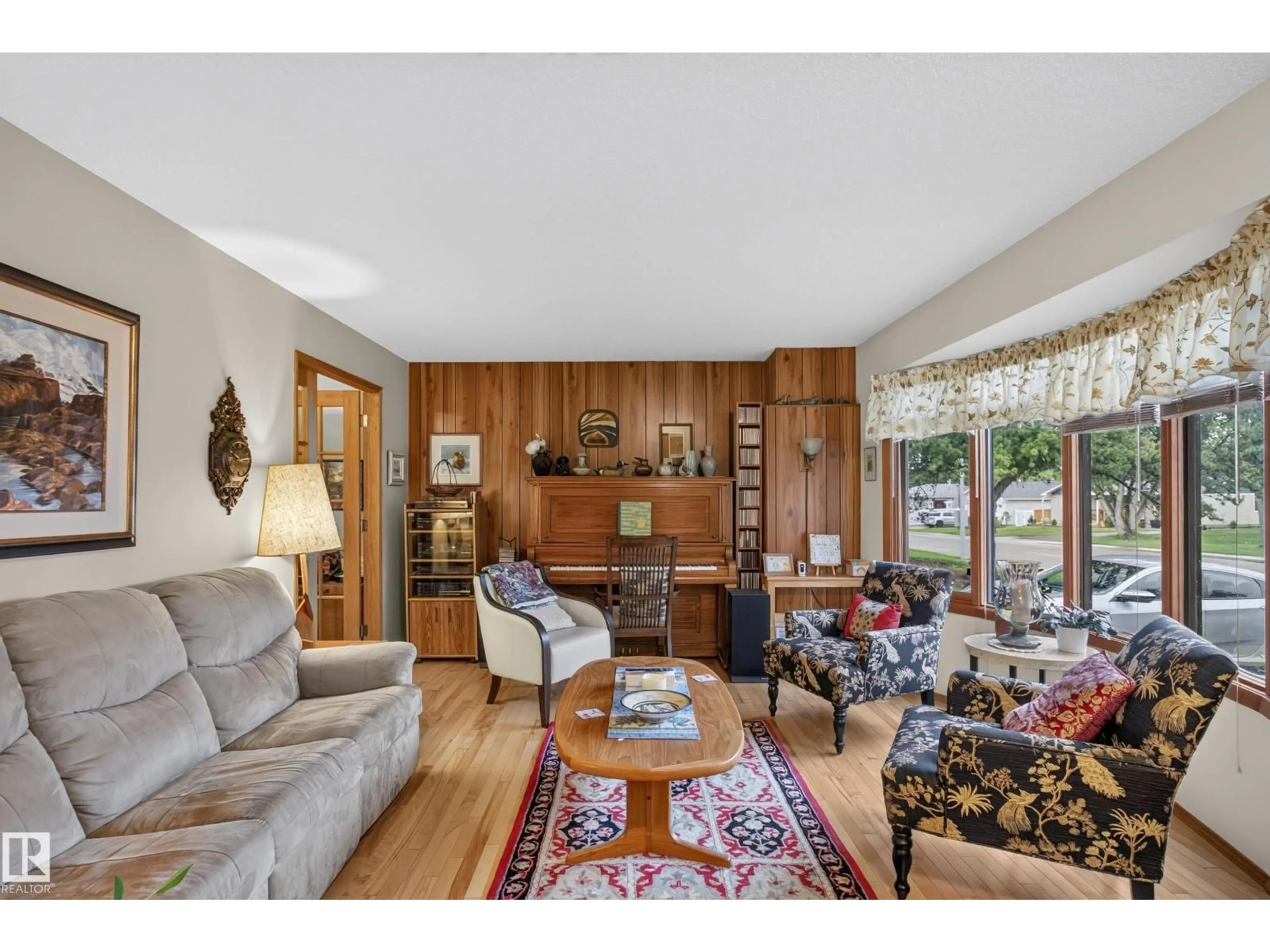 Living room with furniture, wood/laminate floor for 304 FIR ST, Sherwood Park Alberta T8A2B3