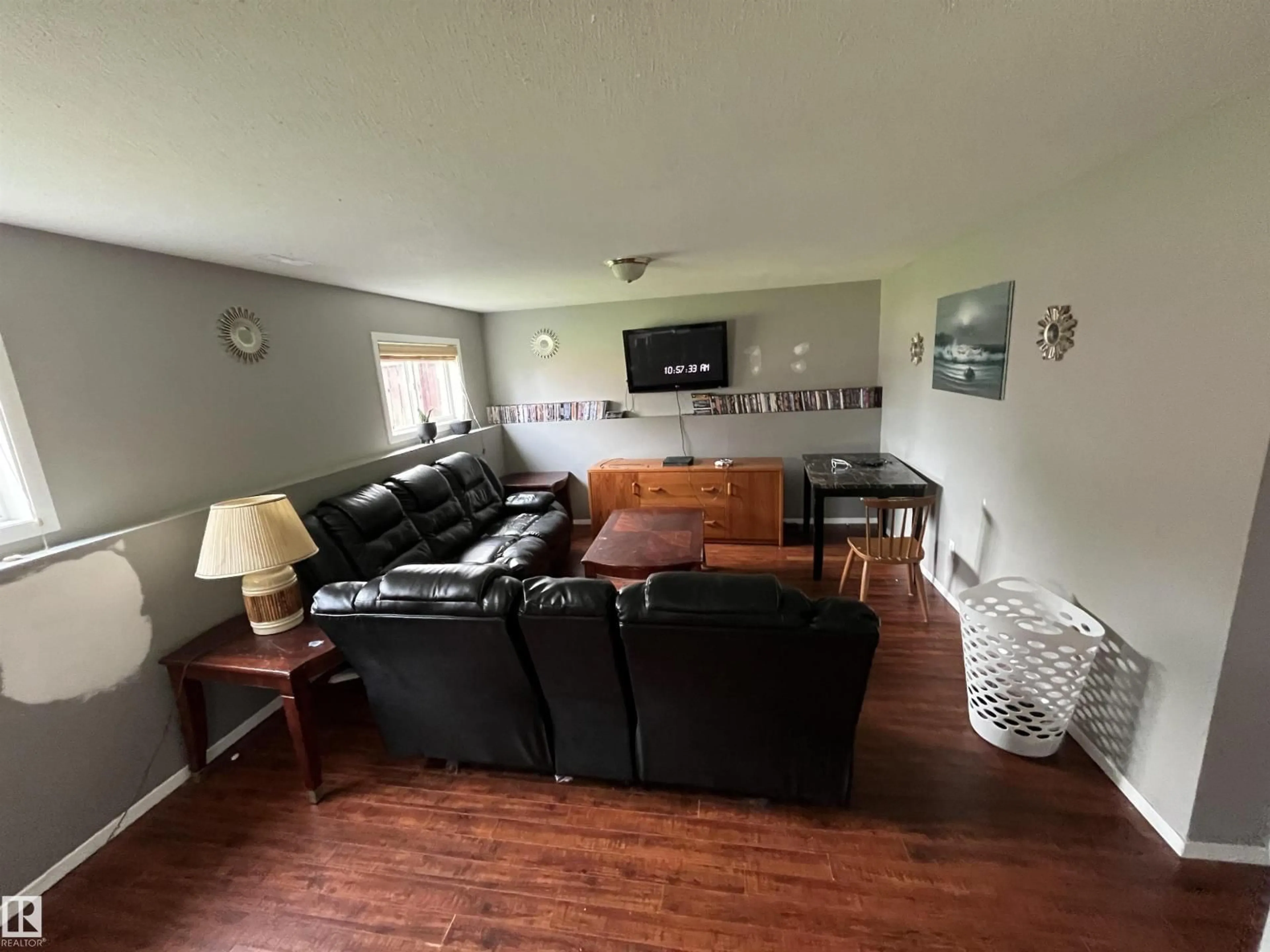 Living room with furniture, wood/laminate floor for 4512 49 AV, Cold Lake Alberta T9M1Z6
