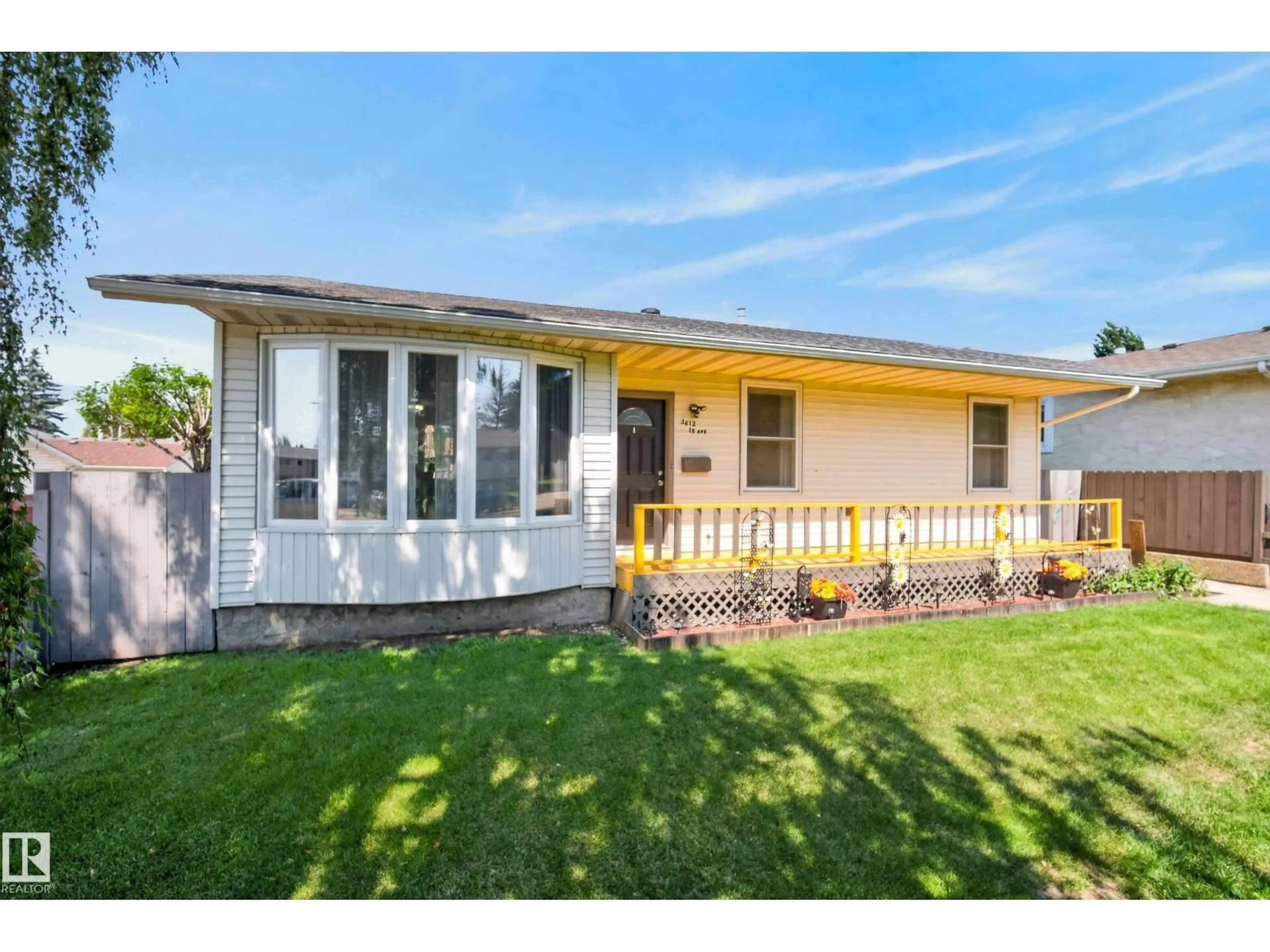 Home with vinyl exterior material, street for 3612 18 AV, Edmonton Alberta T6L3C2
