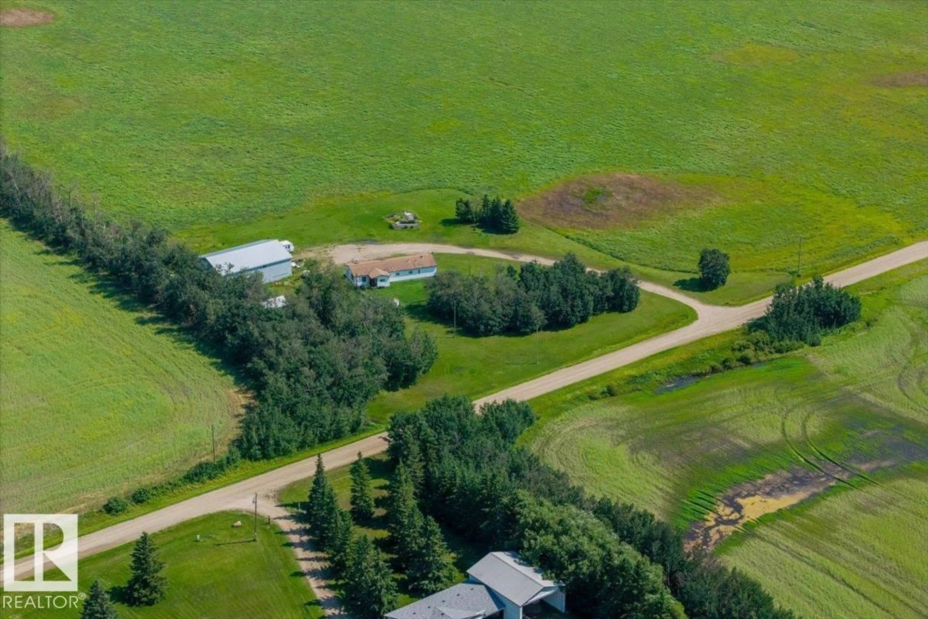 A pic from outside/outdoor area/front of a property/back of a property/a pic from drone, mountain view for 54115 RANGE ROAD 270, Rural Sturgeon County Alberta T8T1G5