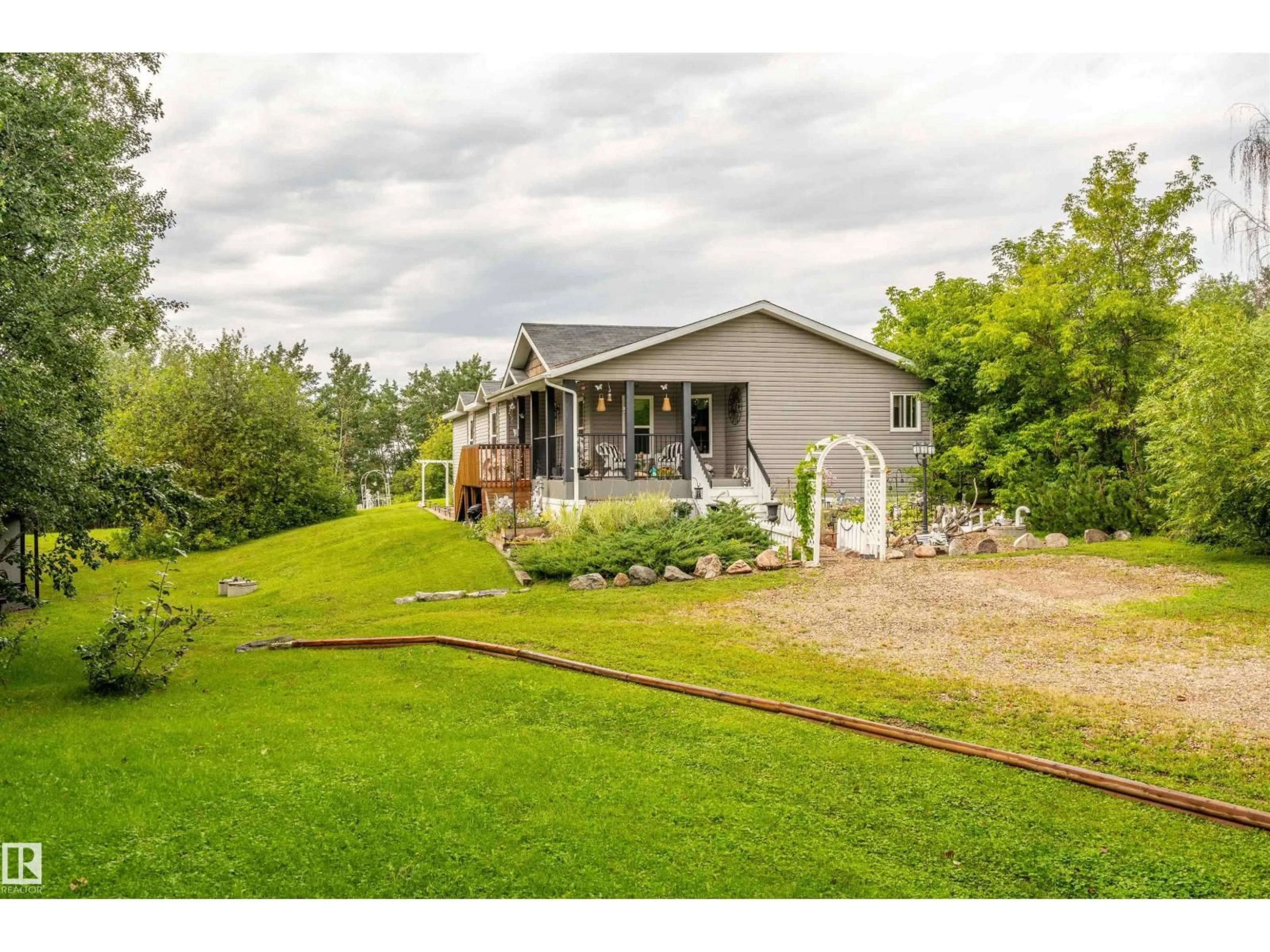 A pic from outside/outdoor area/front of a property/back of a property/a pic from drone, water/lake/river/ocean view for 59526 - 116 HWY 657, Rural Bonnyville M.D. Alberta T9N2G3