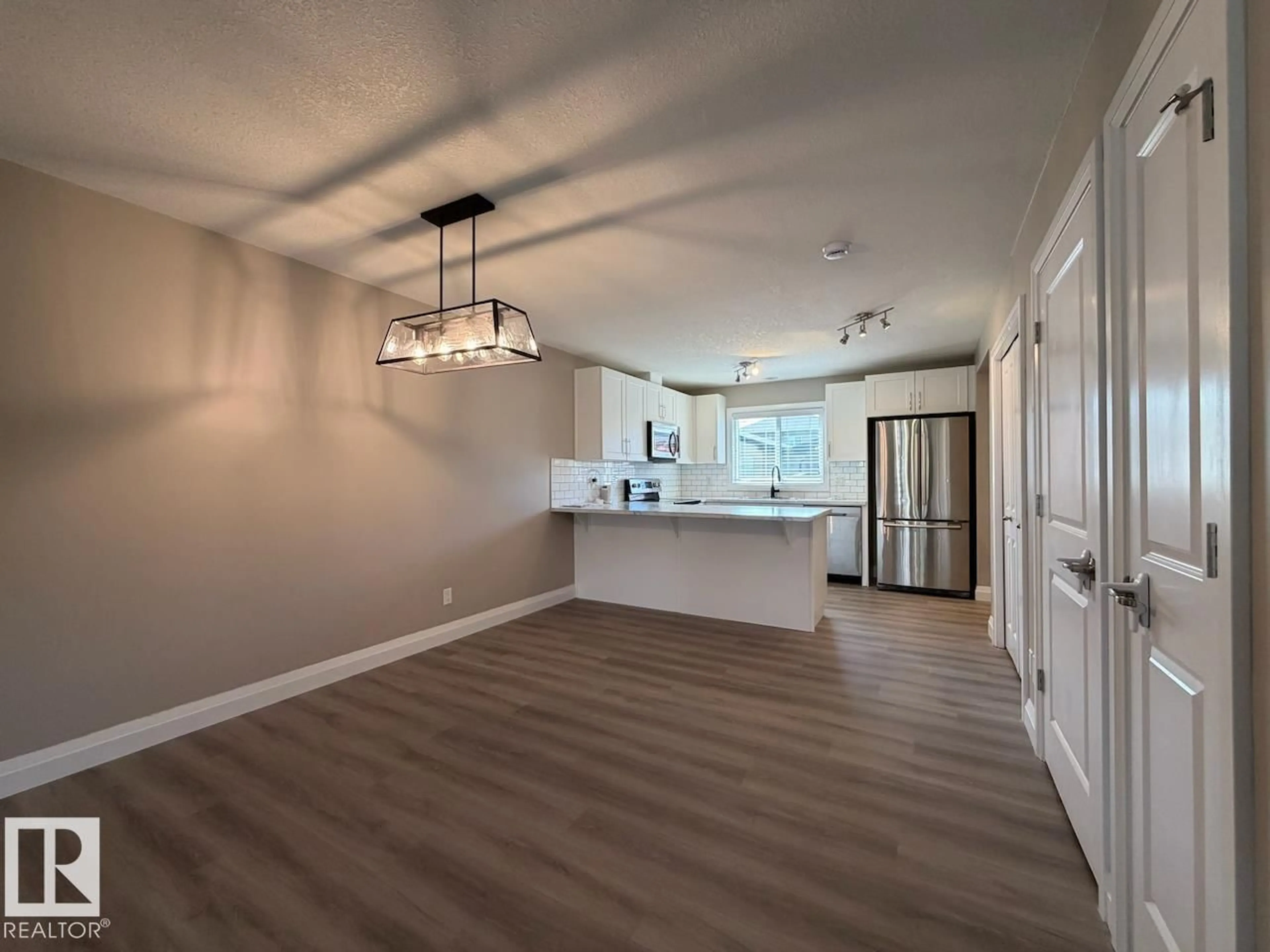 Open concept kitchen, wood/laminate floor for SW - 2616 PRICE CM, Edmonton Alberta T6W3P9