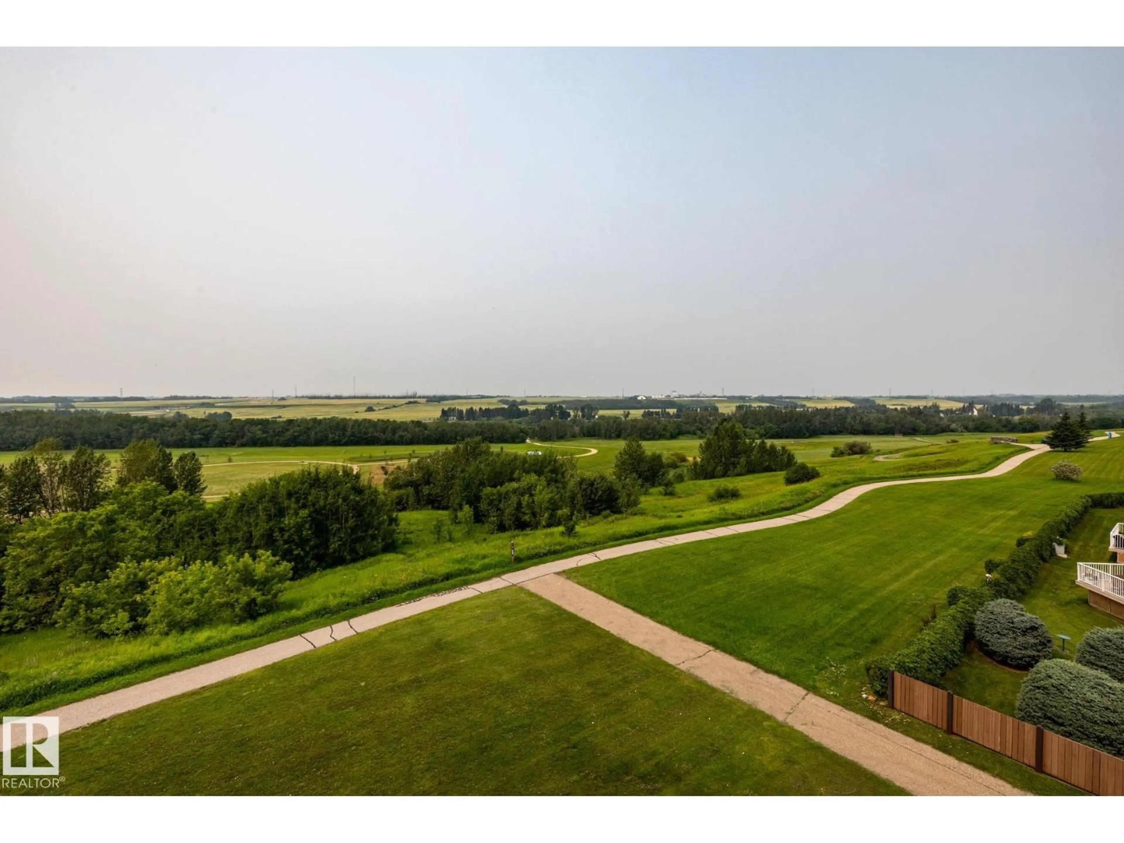 A pic from outside/outdoor area/front of a property/back of a property/a pic from drone, water/lake/river/ocean view for #410 - 9940 SHERRIDON DR, Fort Saskatchewan Alberta T8L4C9