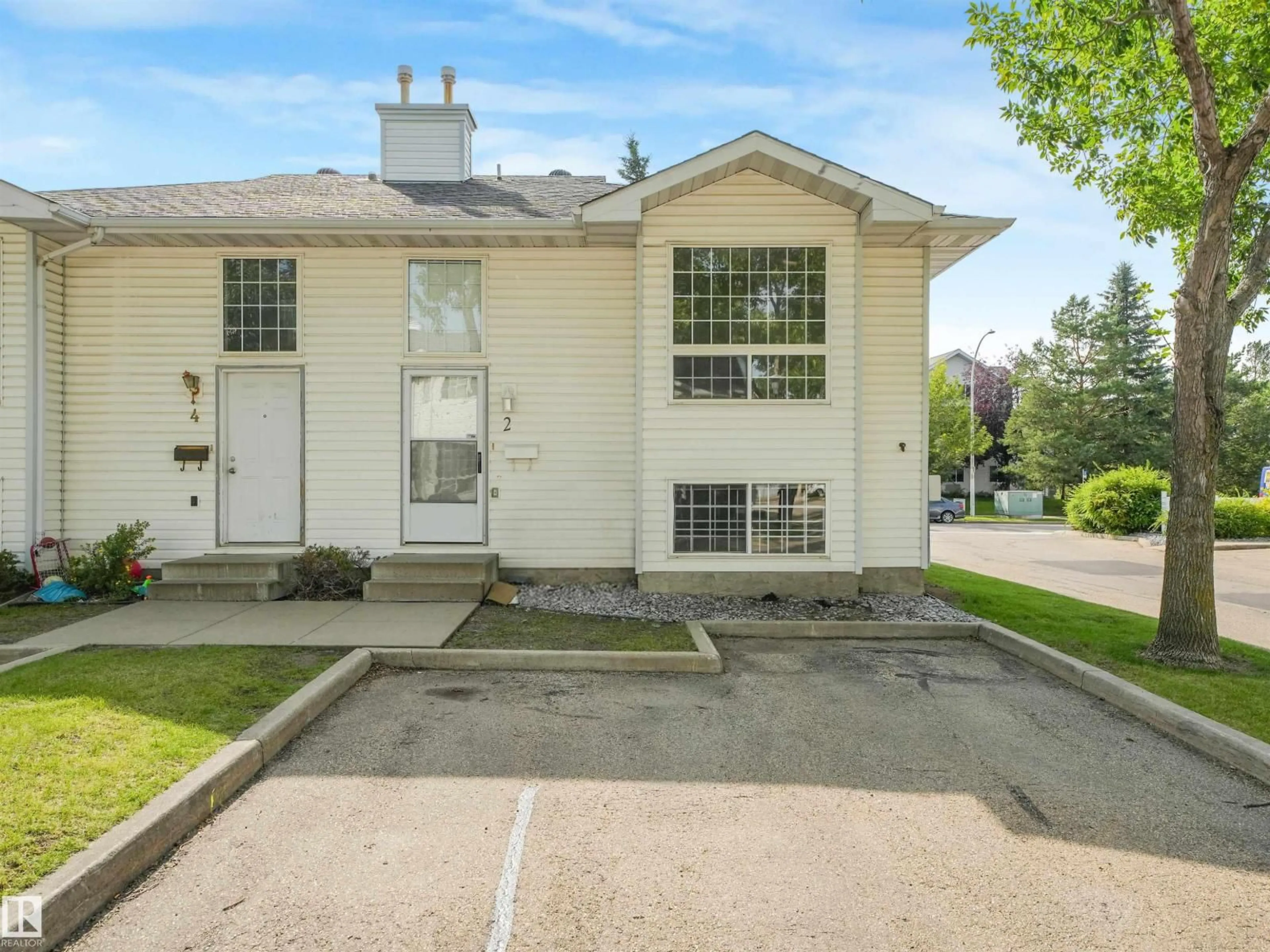 Home with vinyl exterior material, street for #2 - 3311 58 ST, Edmonton Alberta T6L6X3