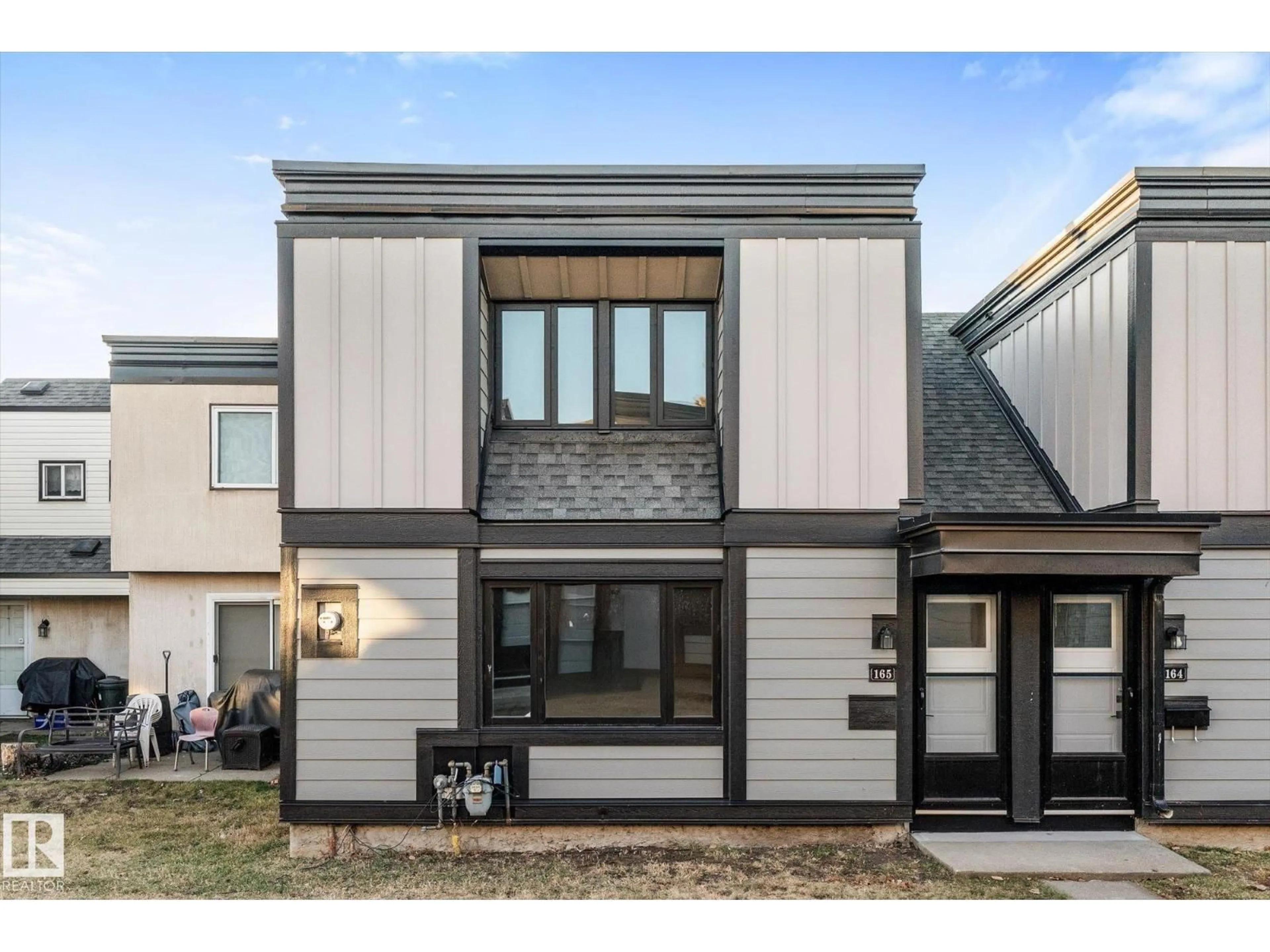 Home with vinyl exterior material, street for 165 3308 113 AV NW, Edmonton Alberta T5W5J8