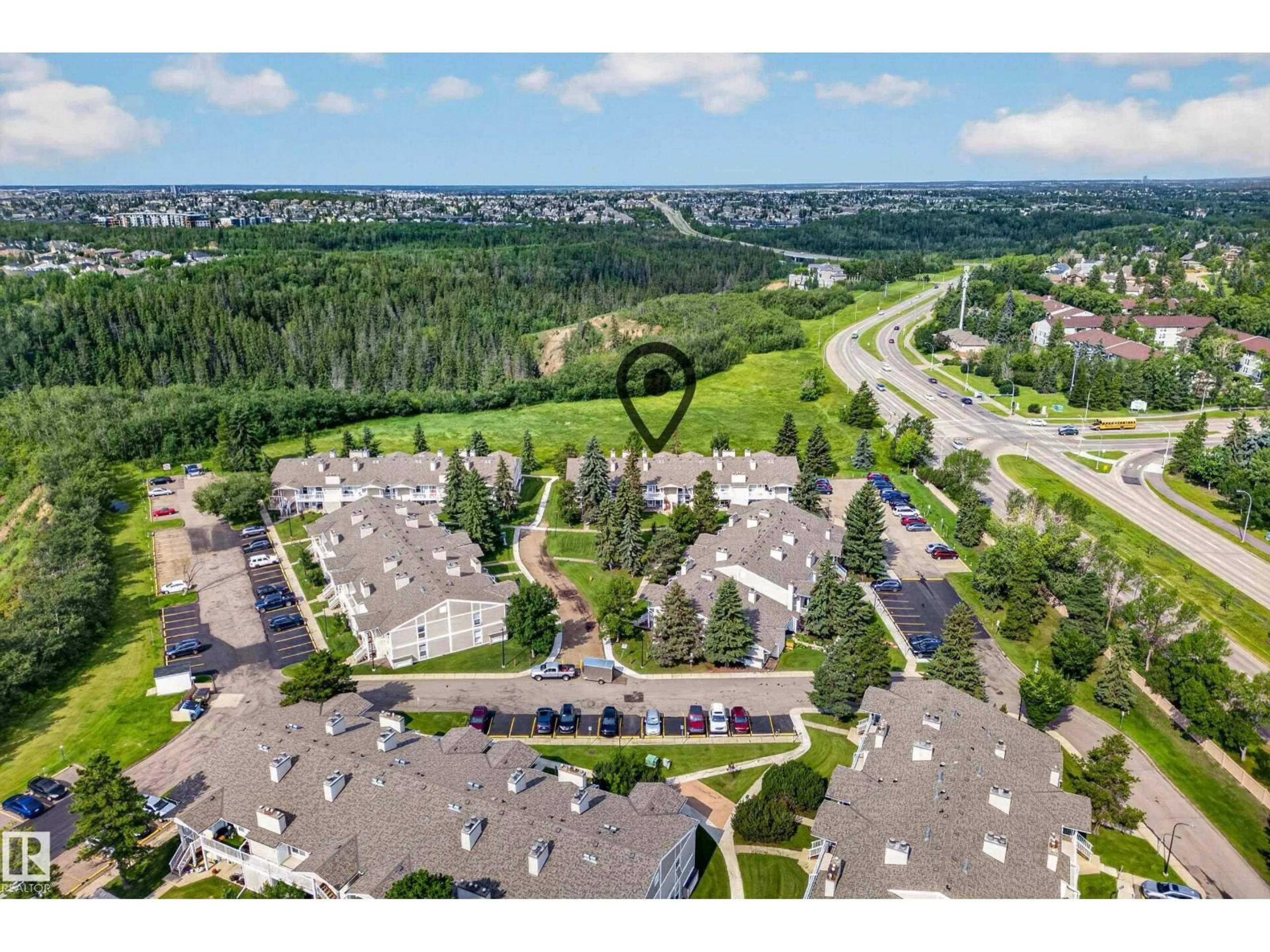 A pic from outside/outdoor area/front of a property/back of a property/a pic from drone, mountain view for #104 - 2204 118 ST, Edmonton Alberta T6J5K2