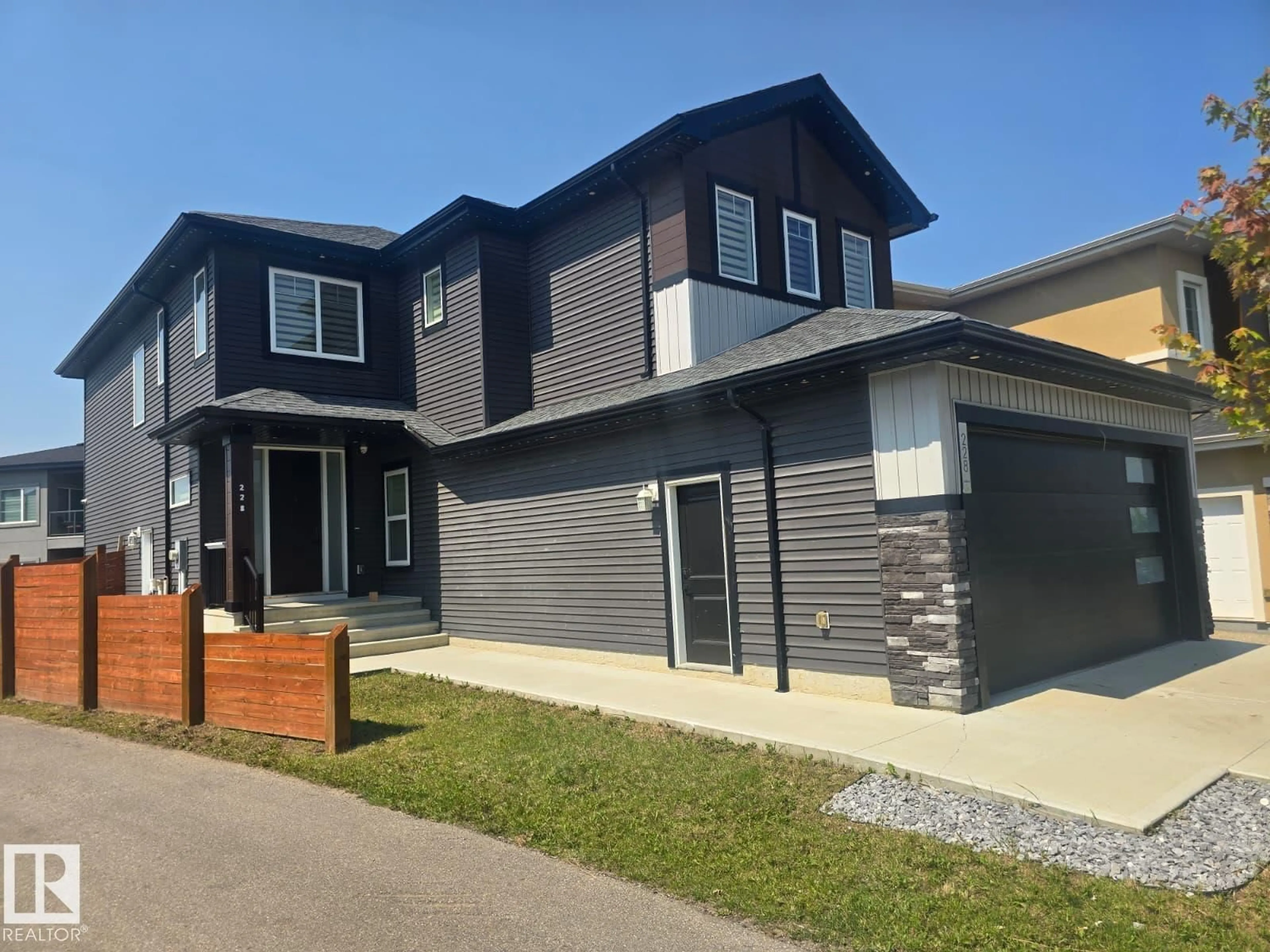 Home with vinyl exterior material, street for SW - 228 36 ST, Edmonton Alberta T6X2W5