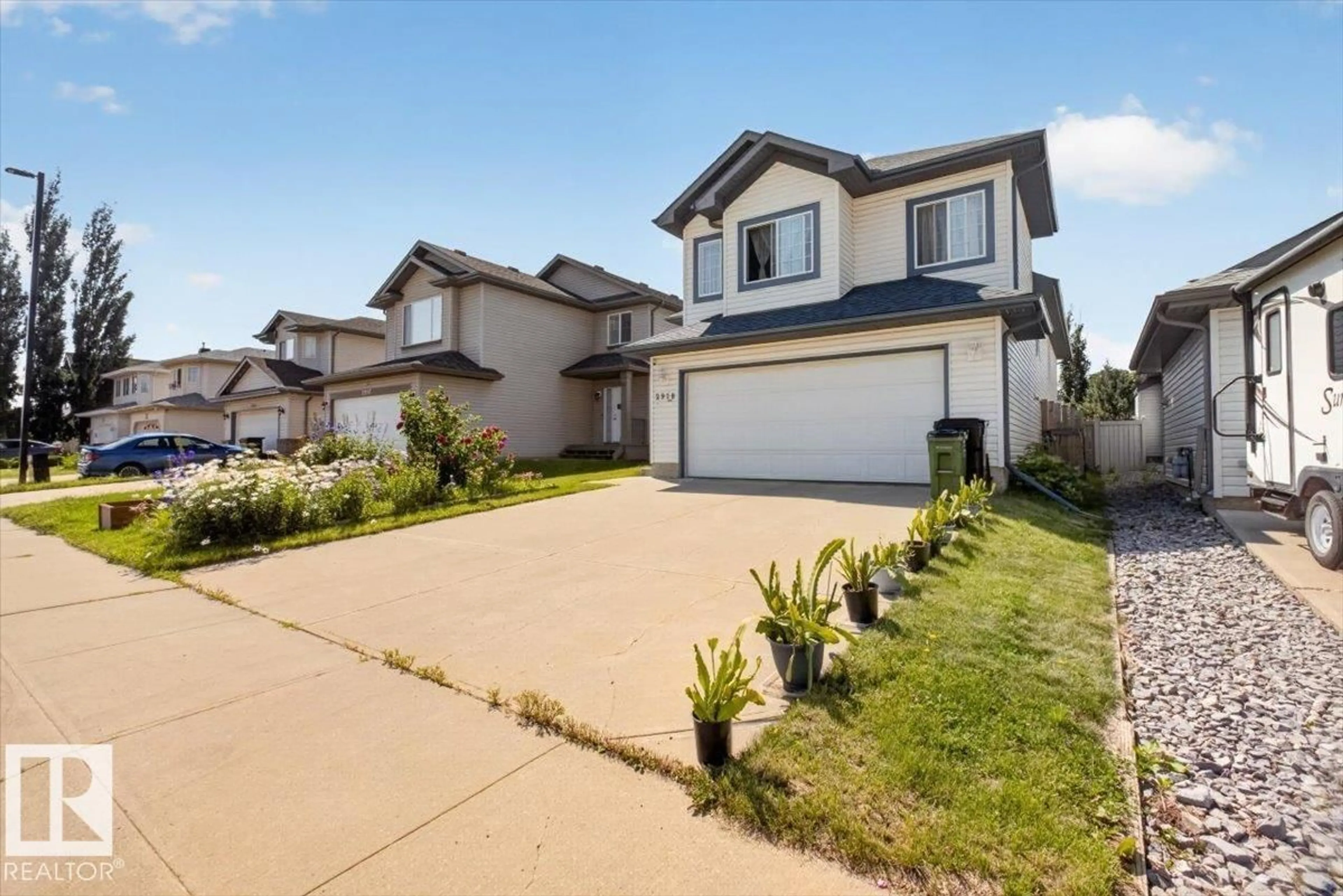 Home with vinyl exterior material, street for NW - 2918 33 ST, Edmonton Alberta T6T1V6