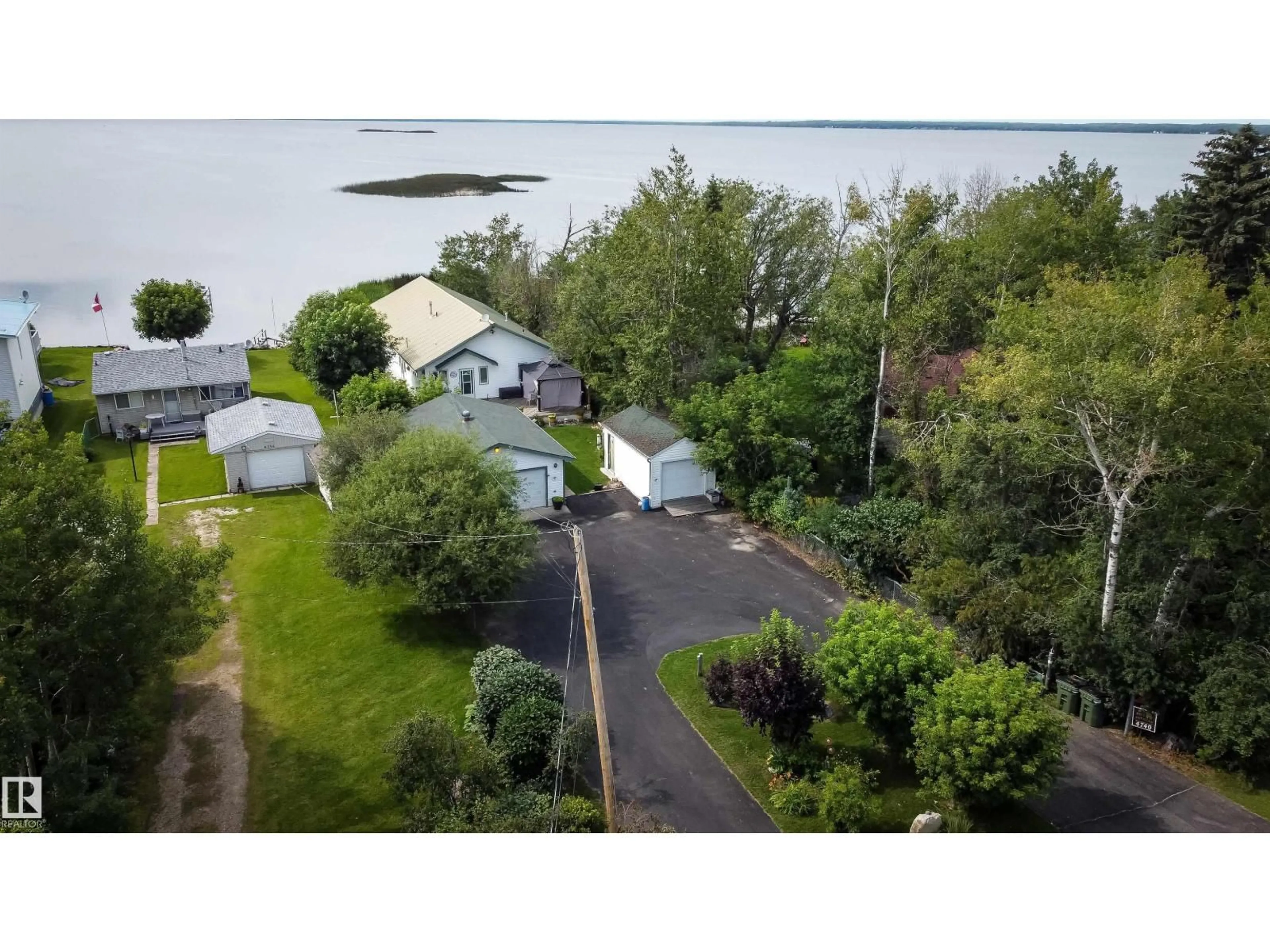 A pic from outside/outdoor area/front of a property/back of a property/a pic from drone, unknown for 4740 SUNSET DR, Rural Lac Ste. Anne County Alberta T0E0A0