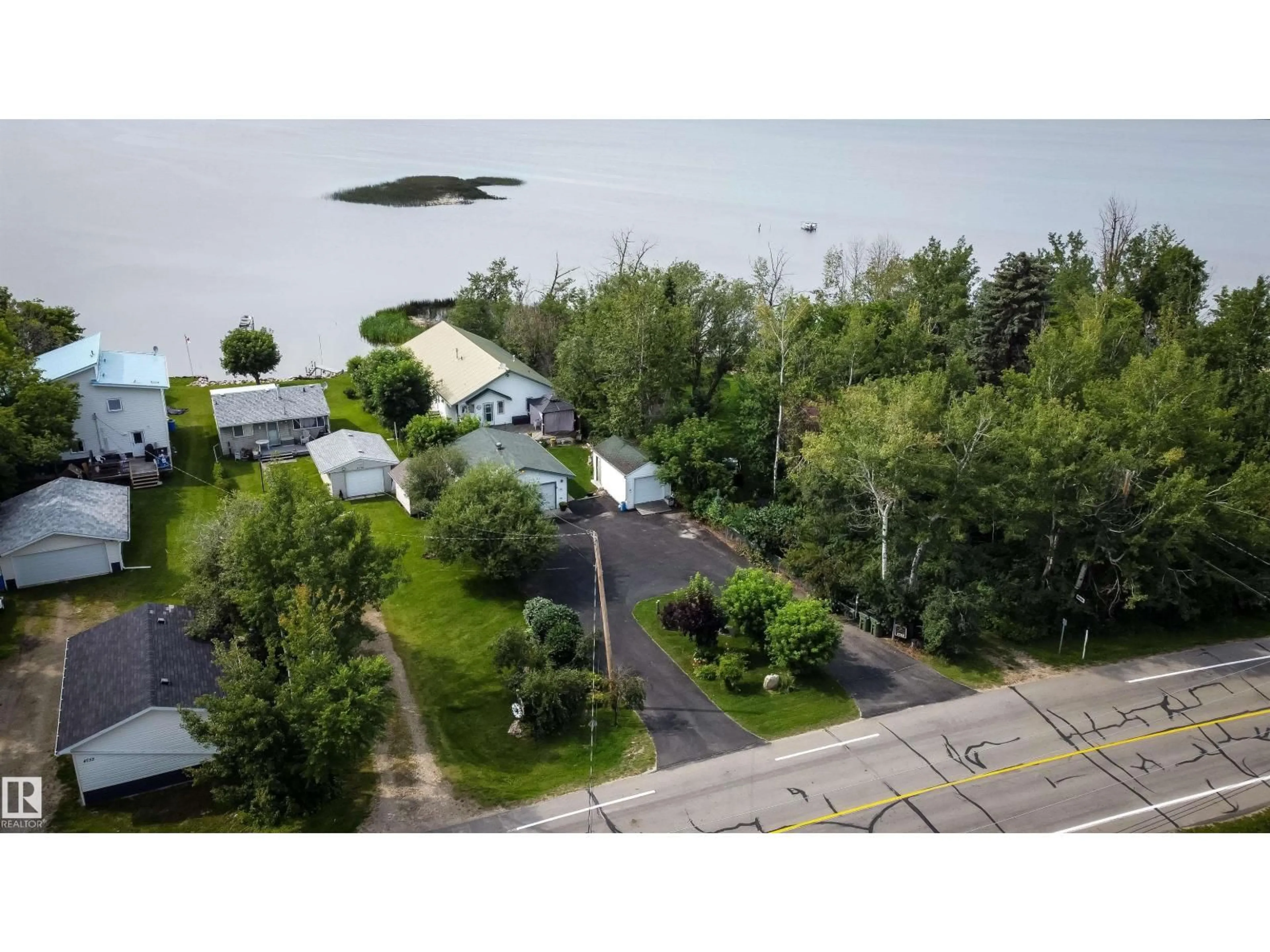 A pic from outside/outdoor area/front of a property/back of a property/a pic from drone, mountain view for 4740 SUNSET DR, Rural Lac Ste. Anne County Alberta T0E0A0
