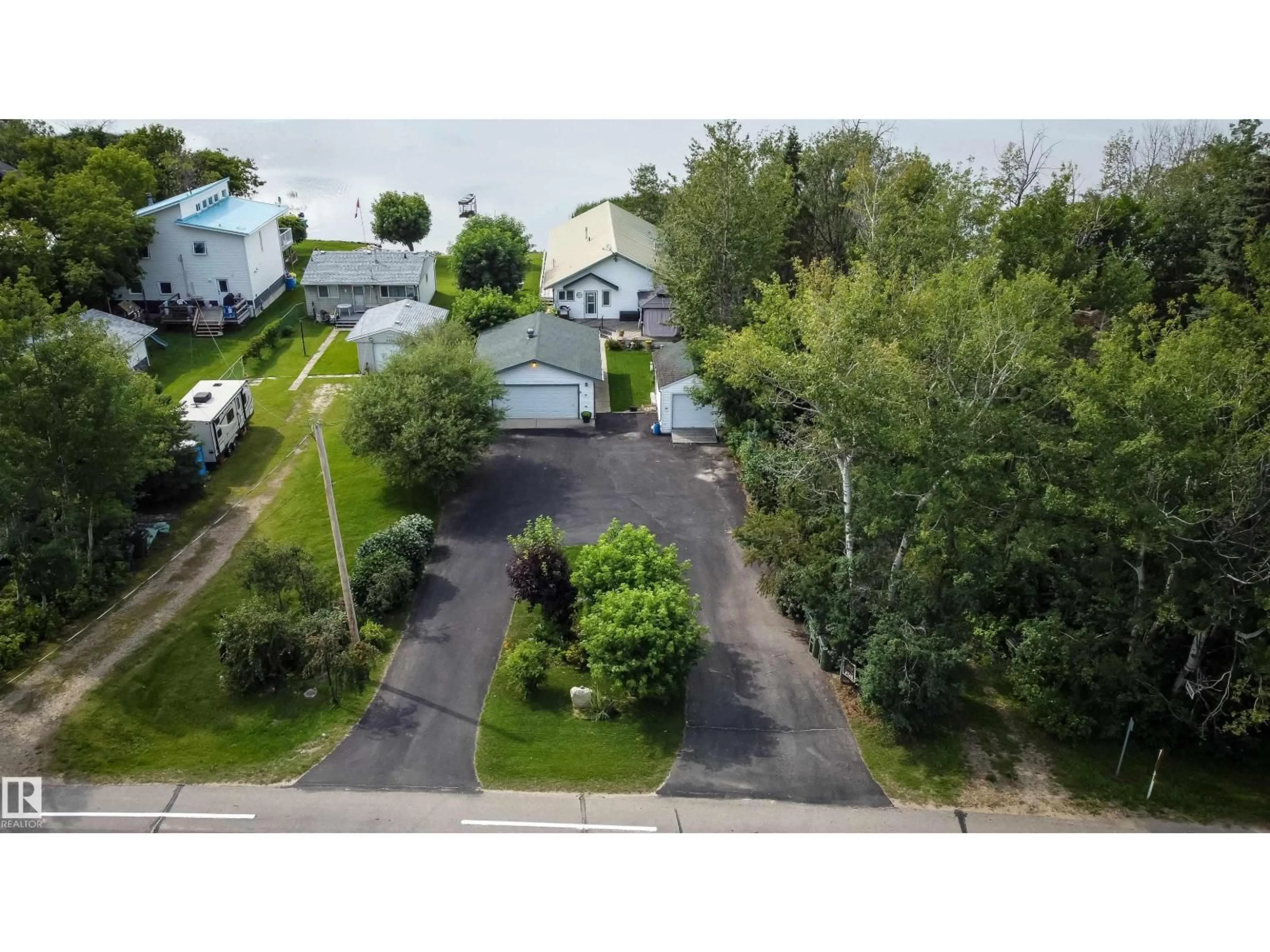 A pic from outside/outdoor area/front of a property/back of a property/a pic from drone, street for 4740 SUNSET DR, Rural Lac Ste. Anne County Alberta T0E0A0