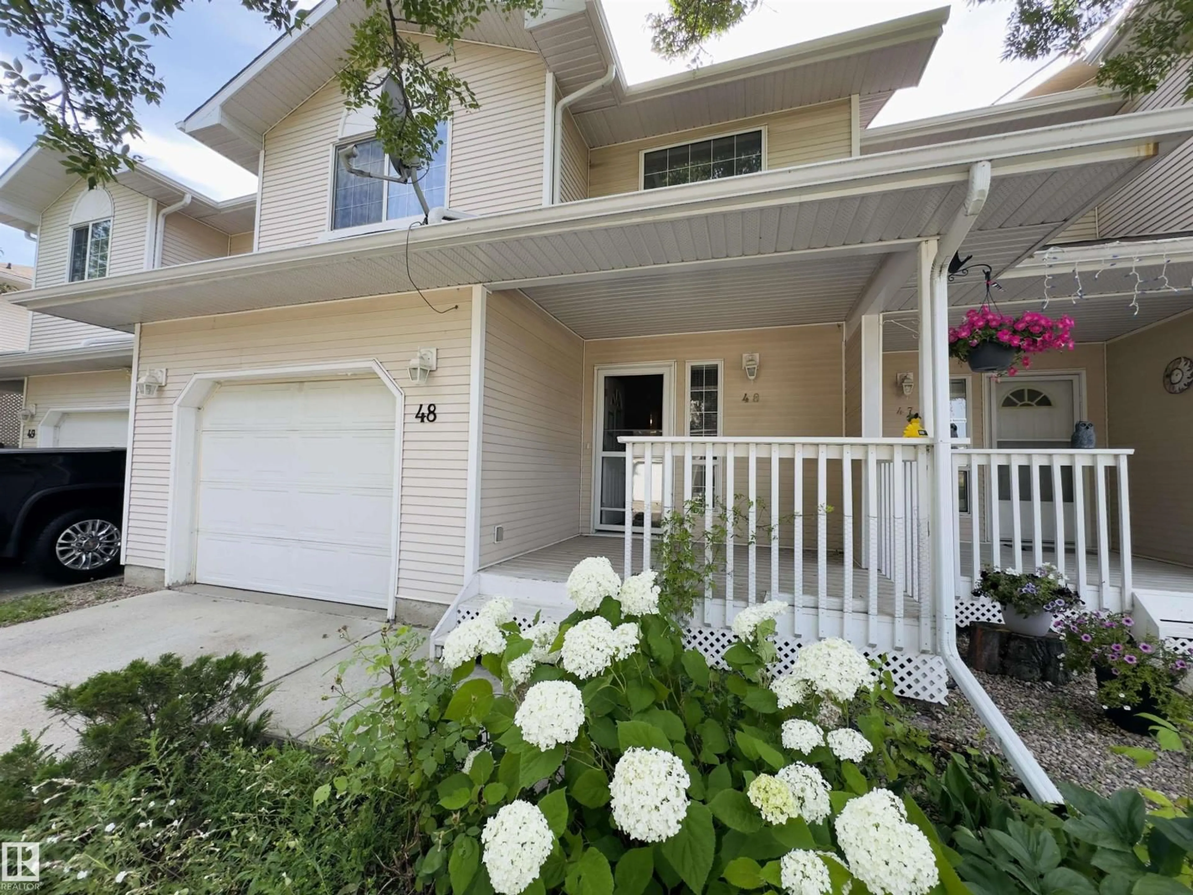 Home with vinyl exterior material, street for #48 - 6608 158 AV, Edmonton Alberta T5Z3H2