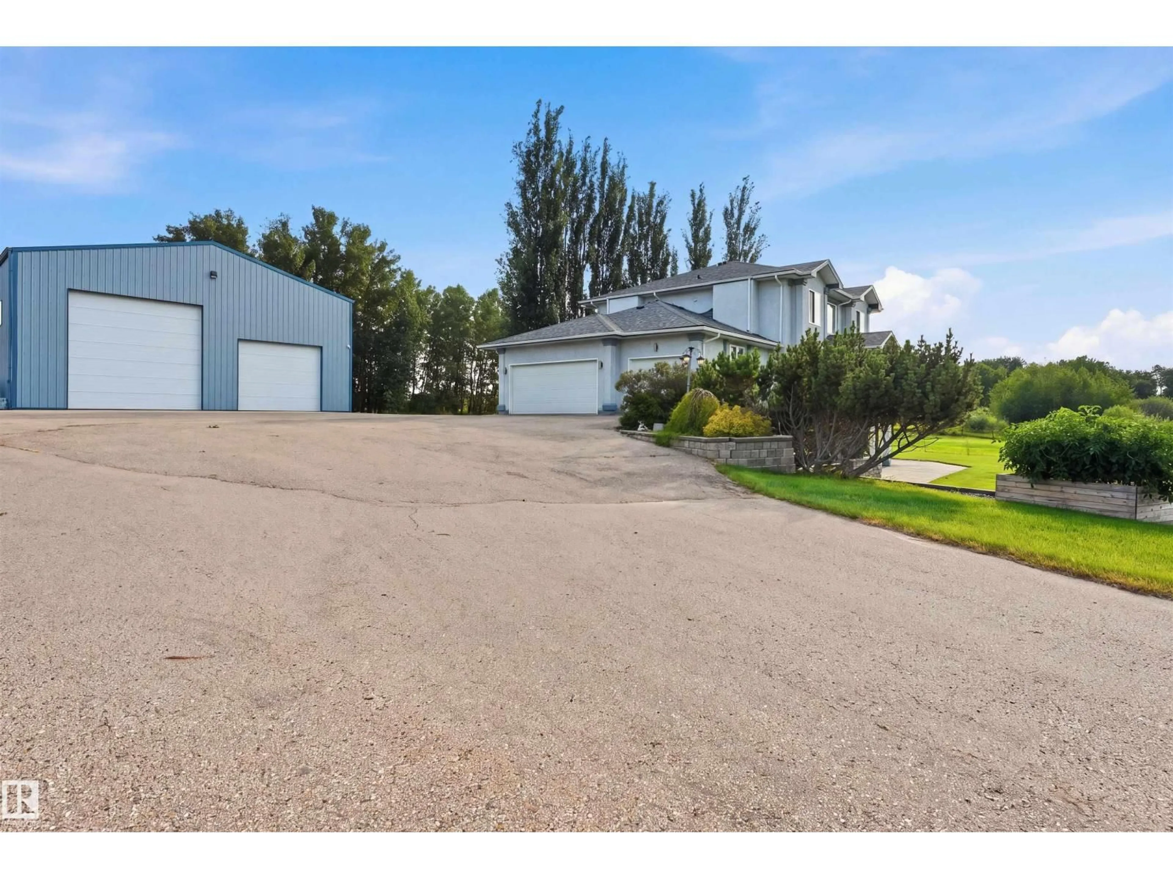 A pic from outside/outdoor area/front of a property/back of a property/a pic from drone, unknown for 43 27507 TWP ROAD 544, Rural Sturgeon County Alberta T8R2B5