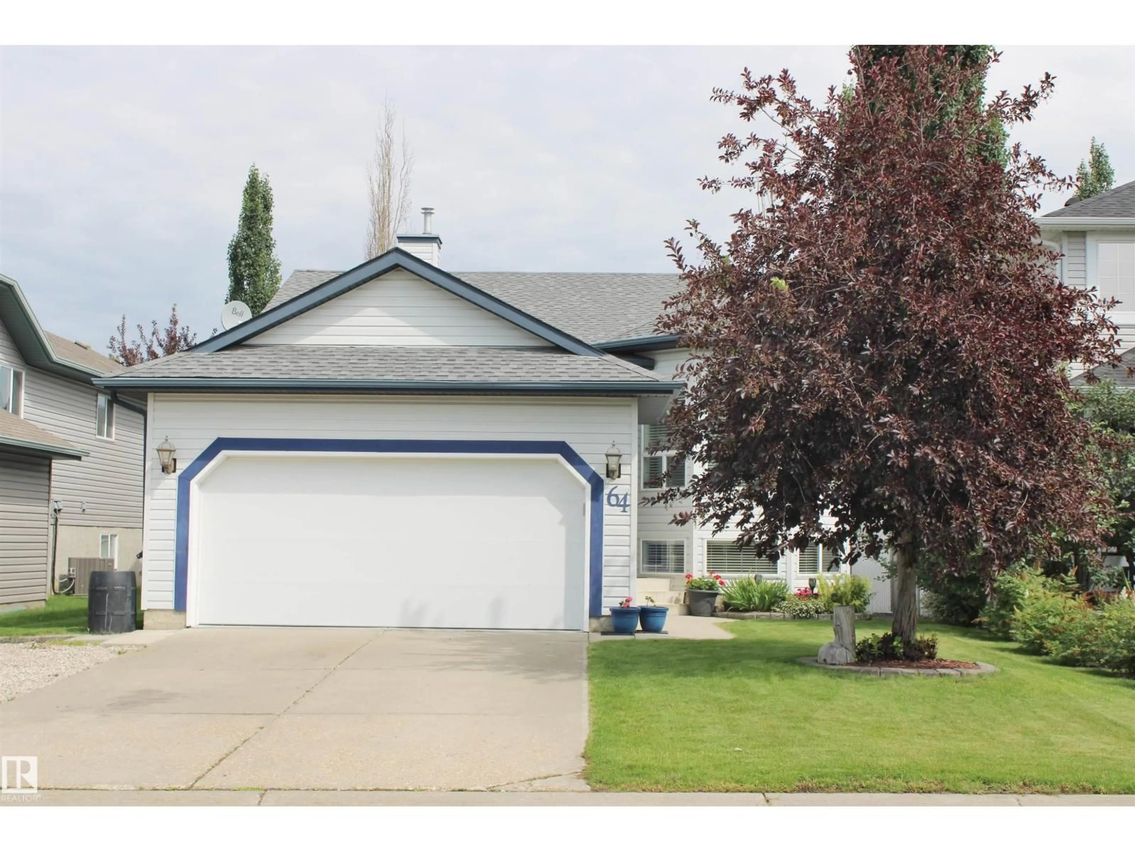 Home with vinyl exterior material, street for 64 CREEKSIDE WY, Spruce Grove Alberta T7X4A2