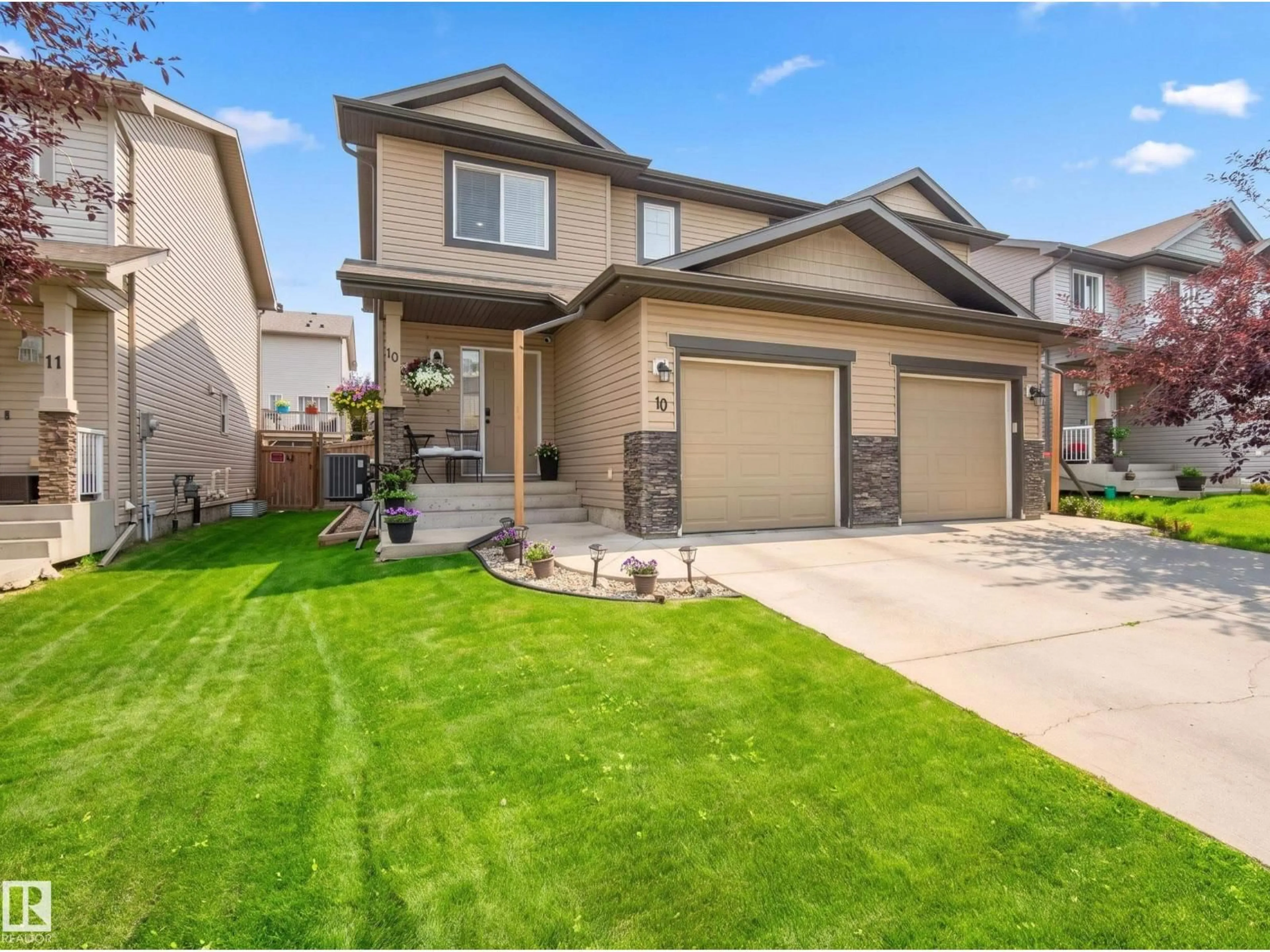 Home with vinyl exterior material, street for 10 85 SPRUCE VILLAGE DR, Spruce Grove Alberta T7X0L2
