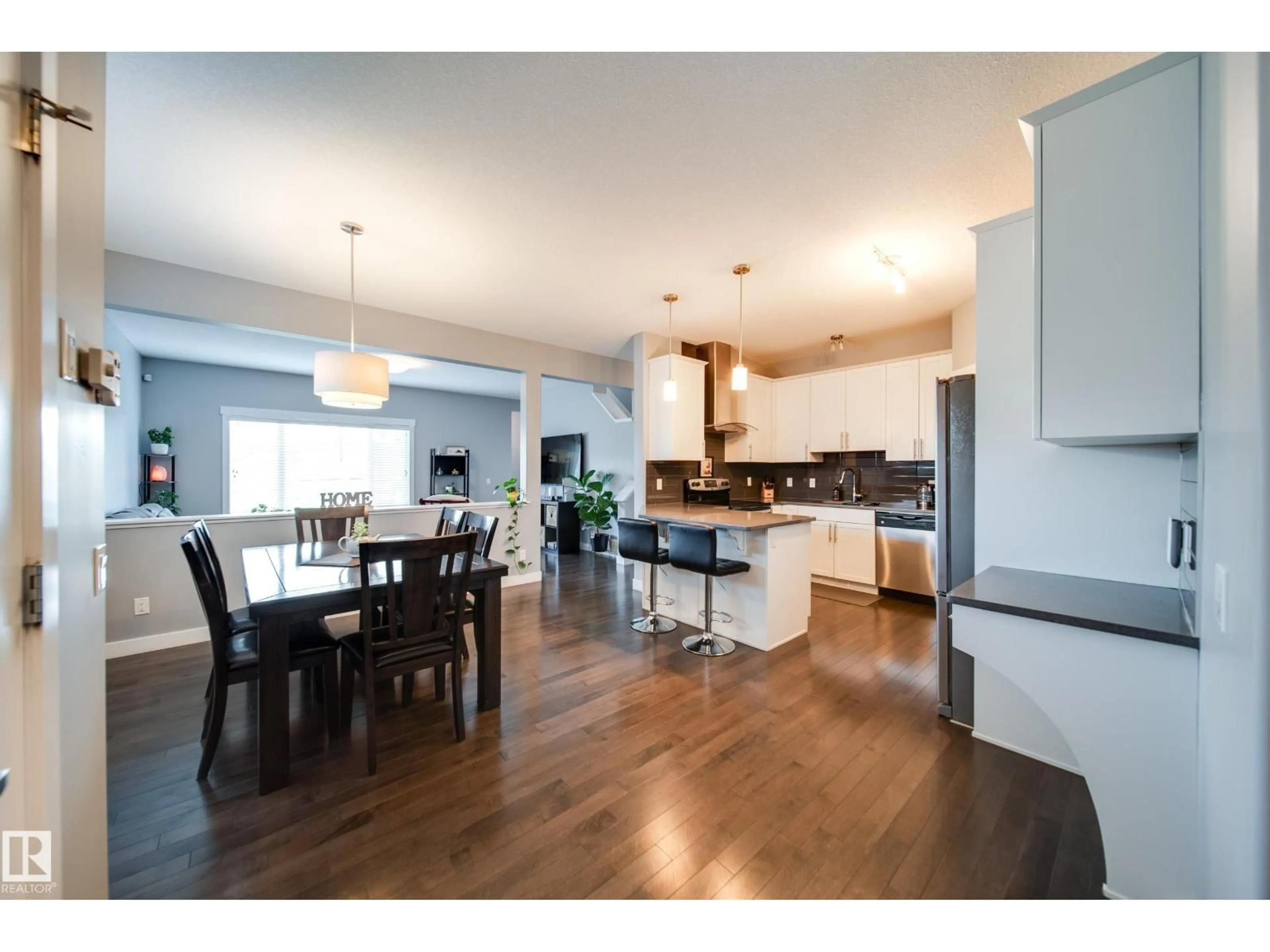 Open concept kitchen, wood/laminate floor for 6305 167A AV, Edmonton Alberta T5Y3P7