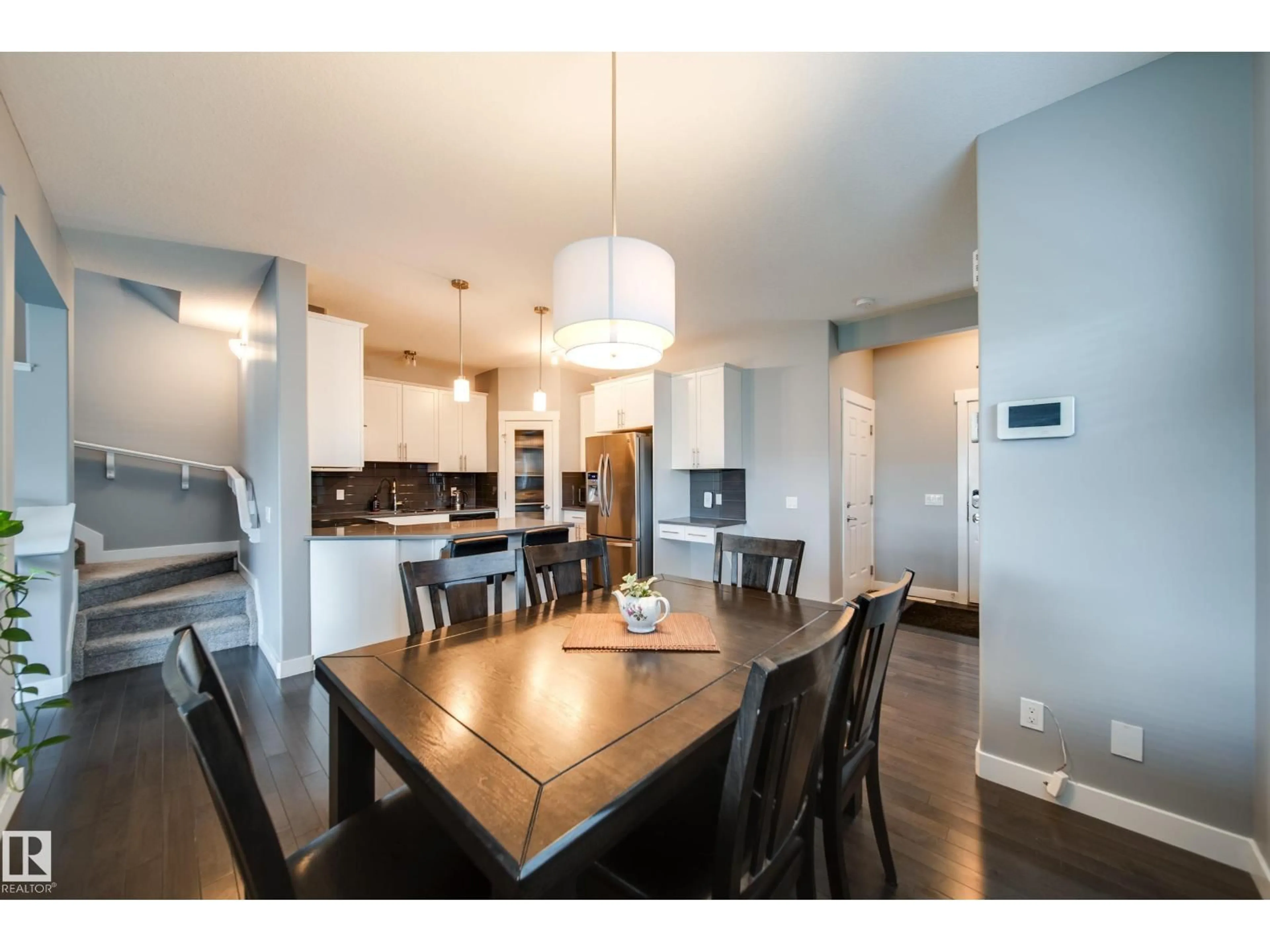 Open concept kitchen, wood/laminate floor for 6305 167A AV, Edmonton Alberta T5Y3P7