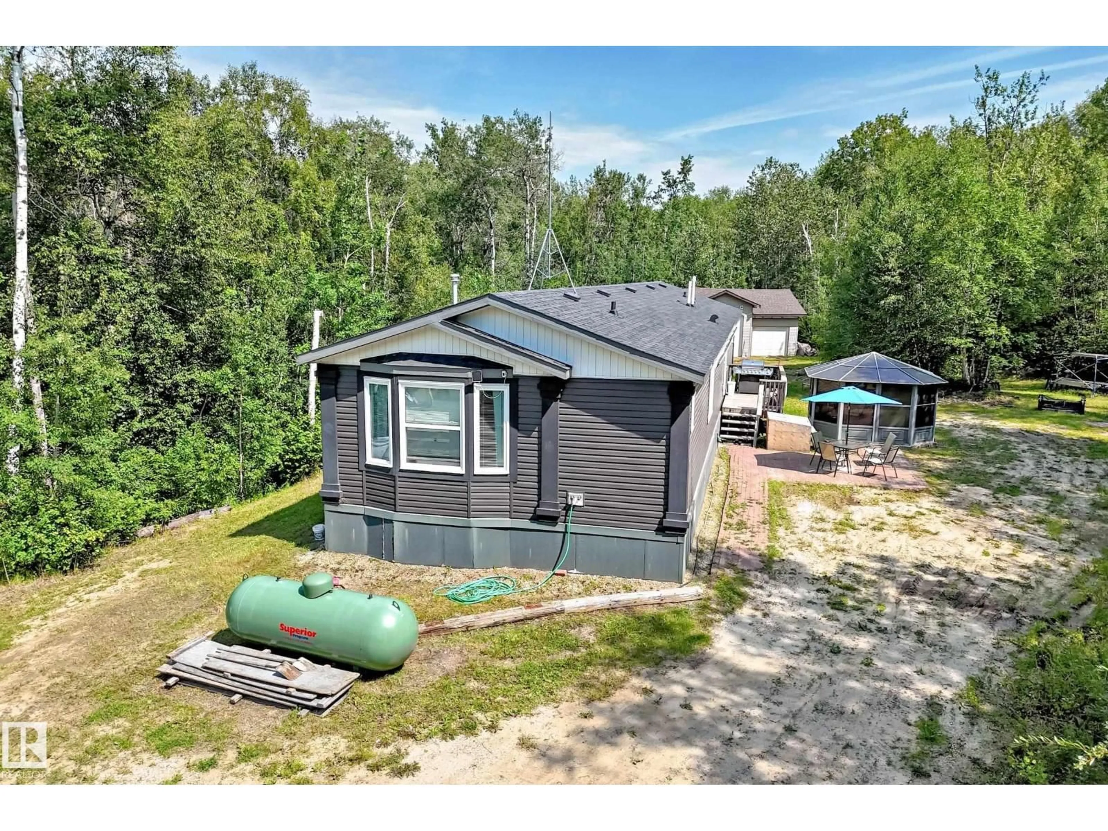 A pic from outside/outdoor area/front of a property/back of a property/a pic from drone, water/lake/river/ocean view for 30 55220 RGE ROAD 13, Rural Lac Ste. Anne County Alberta T5R2R6