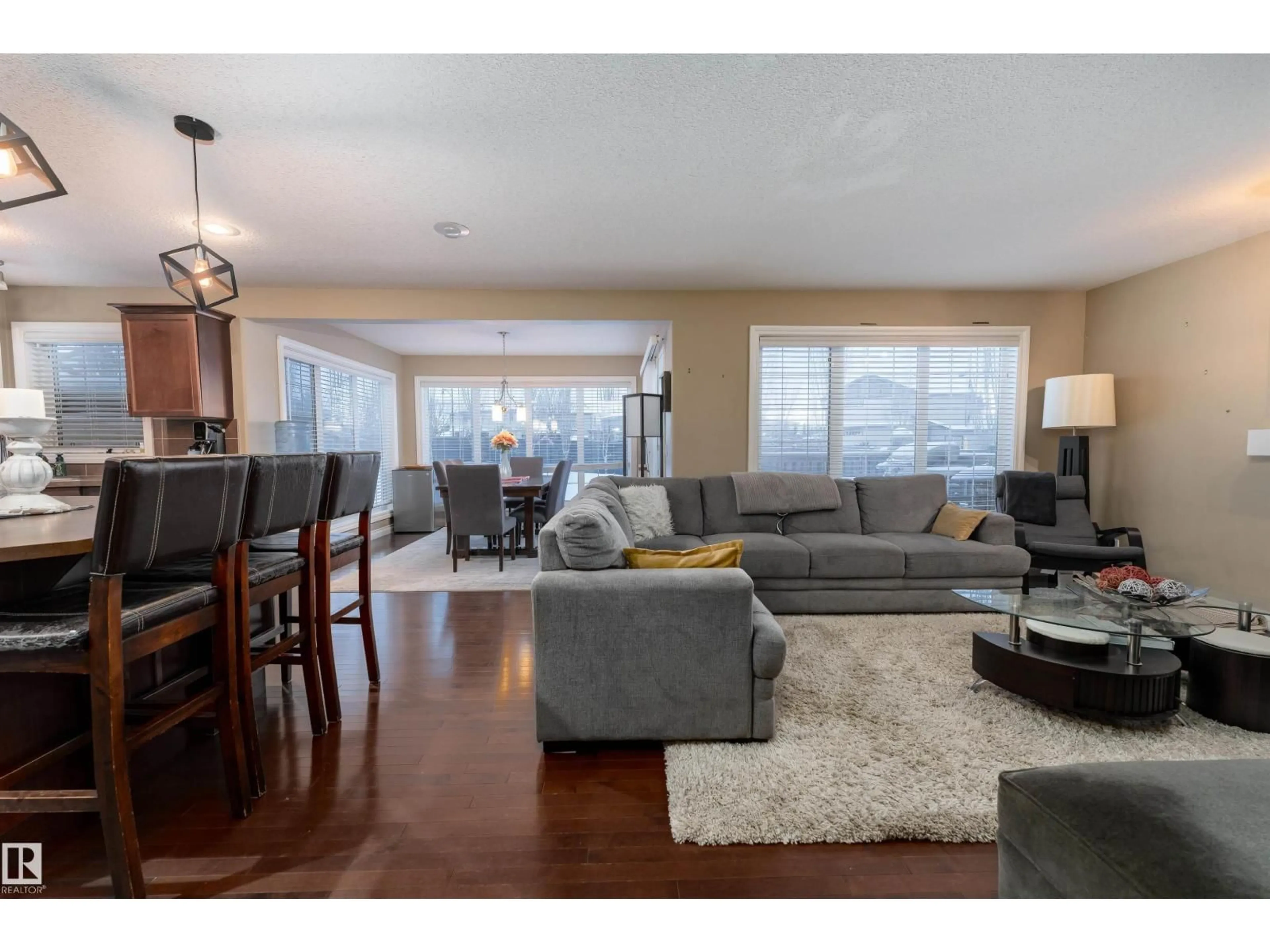 Living room with furniture, wood/laminate floor for 3514 GOODRIDGE BA, Edmonton Alberta T5T4C6