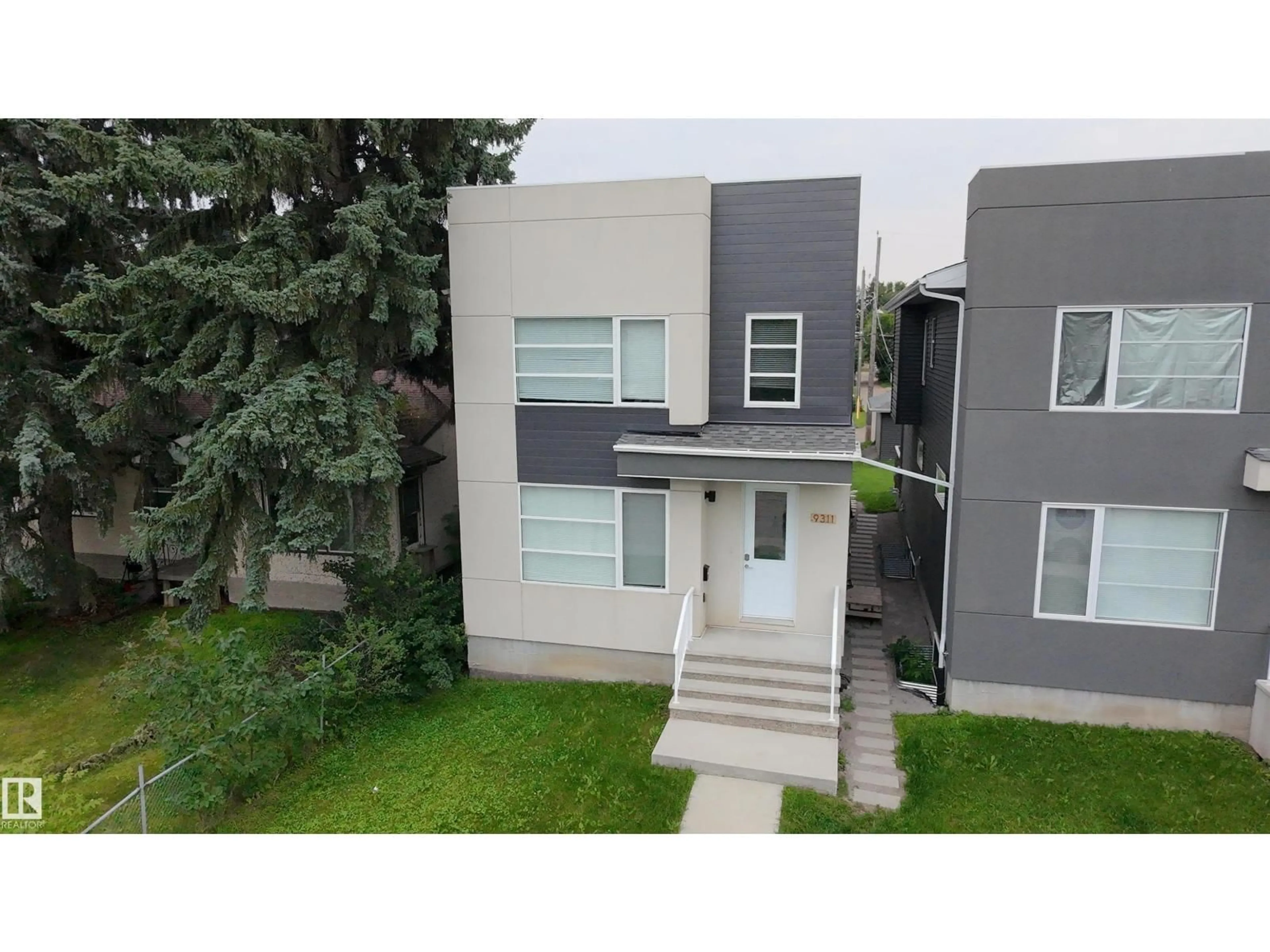 A pic from outside/outdoor area/front of a property/back of a property/a pic from drone, street for 9311 66 AV, Edmonton Alberta T6E0L8