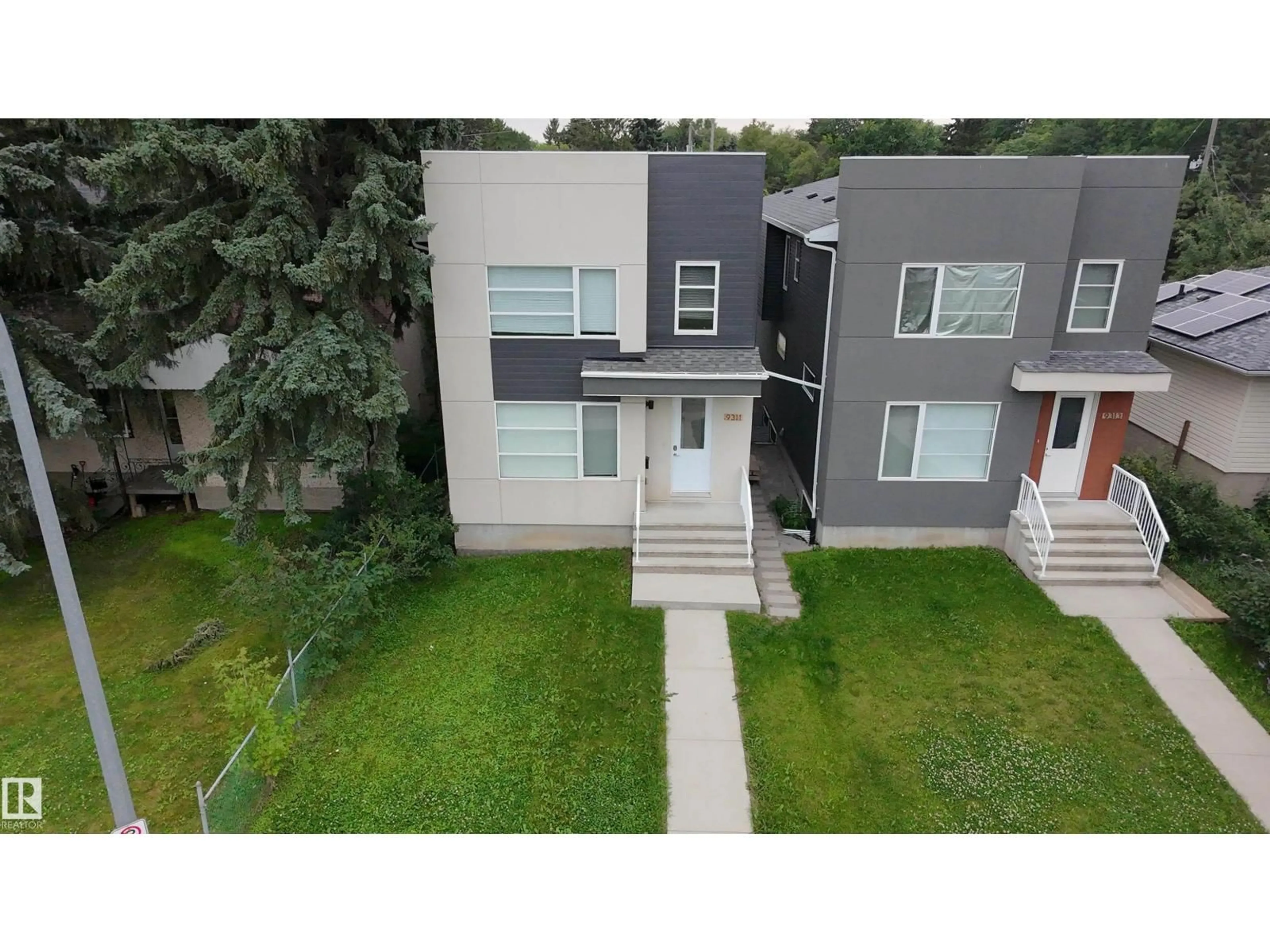 A pic from outside/outdoor area/front of a property/back of a property/a pic from drone, street for 9311 66 AV, Edmonton Alberta T6E0L8