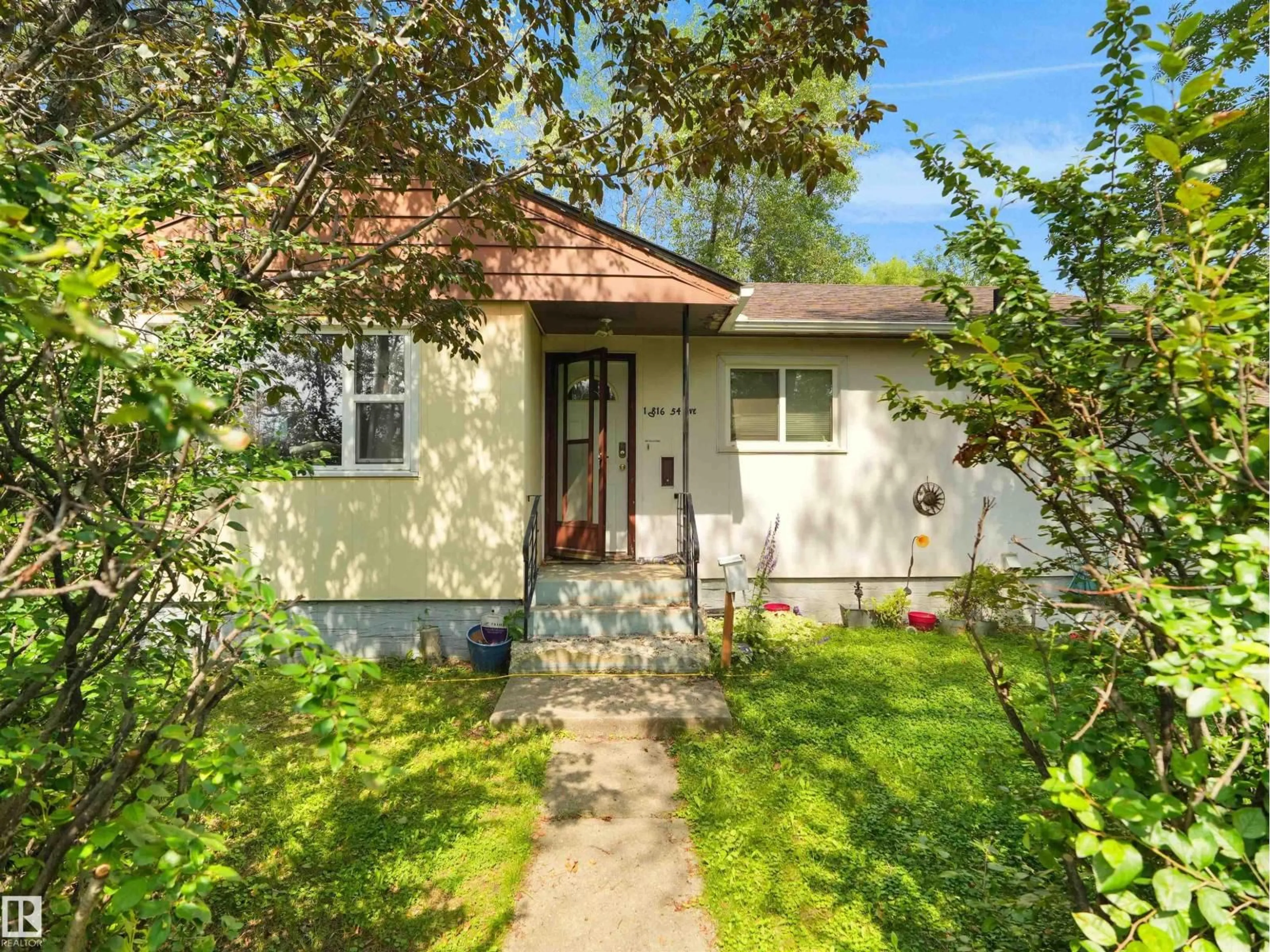 Home with vinyl exterior material, street for 10816 54 AV, Edmonton Alberta T6H0T9