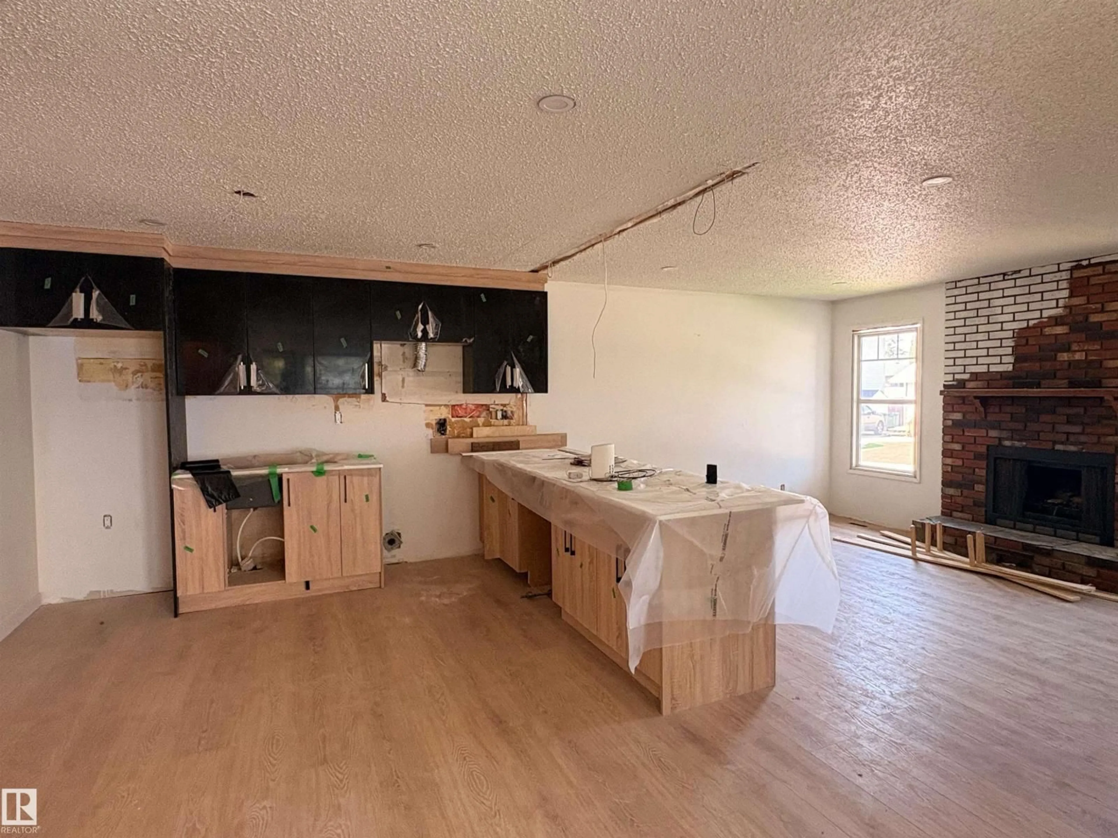 Open concept kitchen, wood/laminate floor for 18007 73 AV, Edmonton Alberta T5T3K2