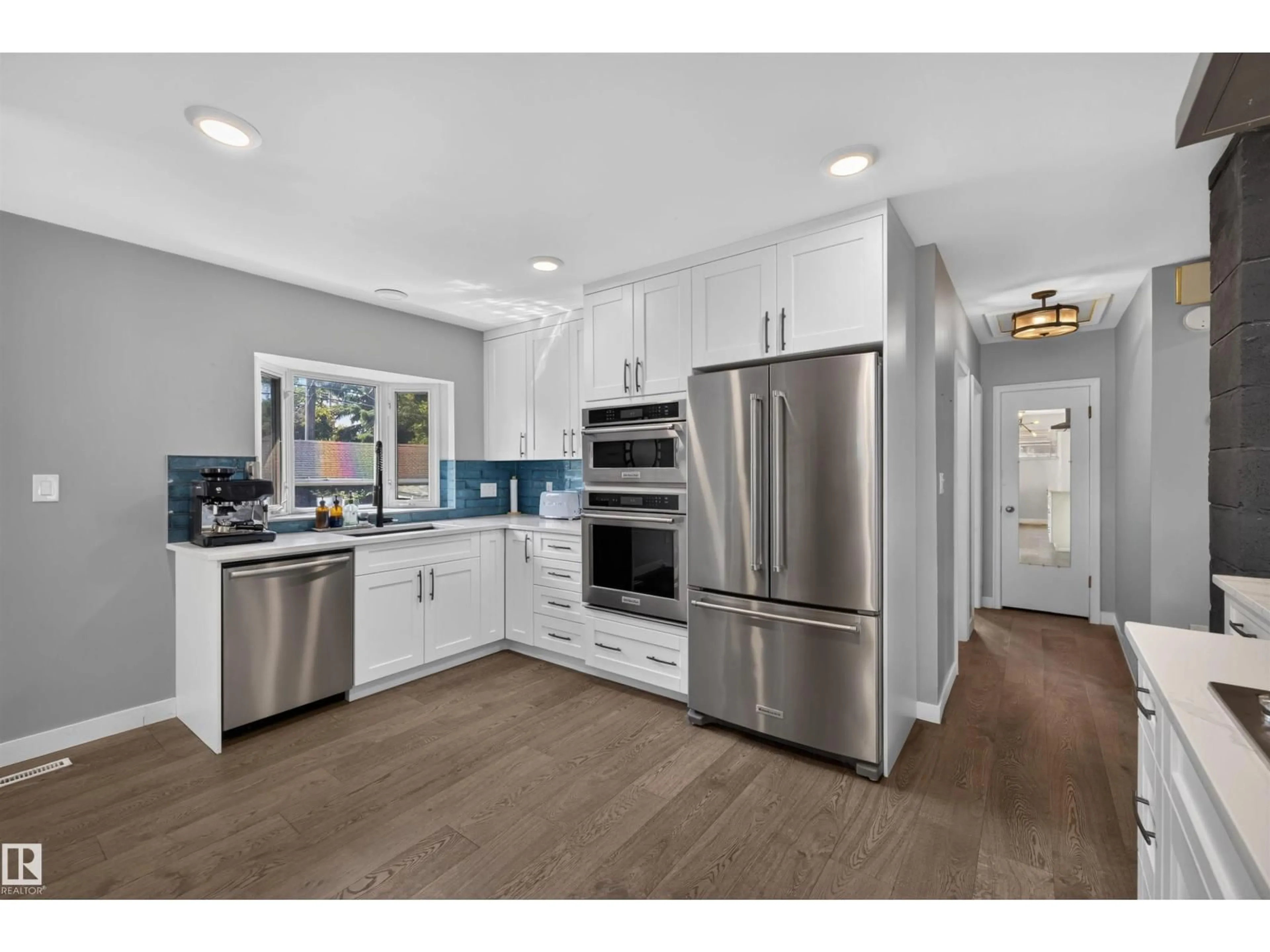 Open concept kitchen, ceramic/tile floor for 14447 107A AV, Edmonton Alberta T5N1G3