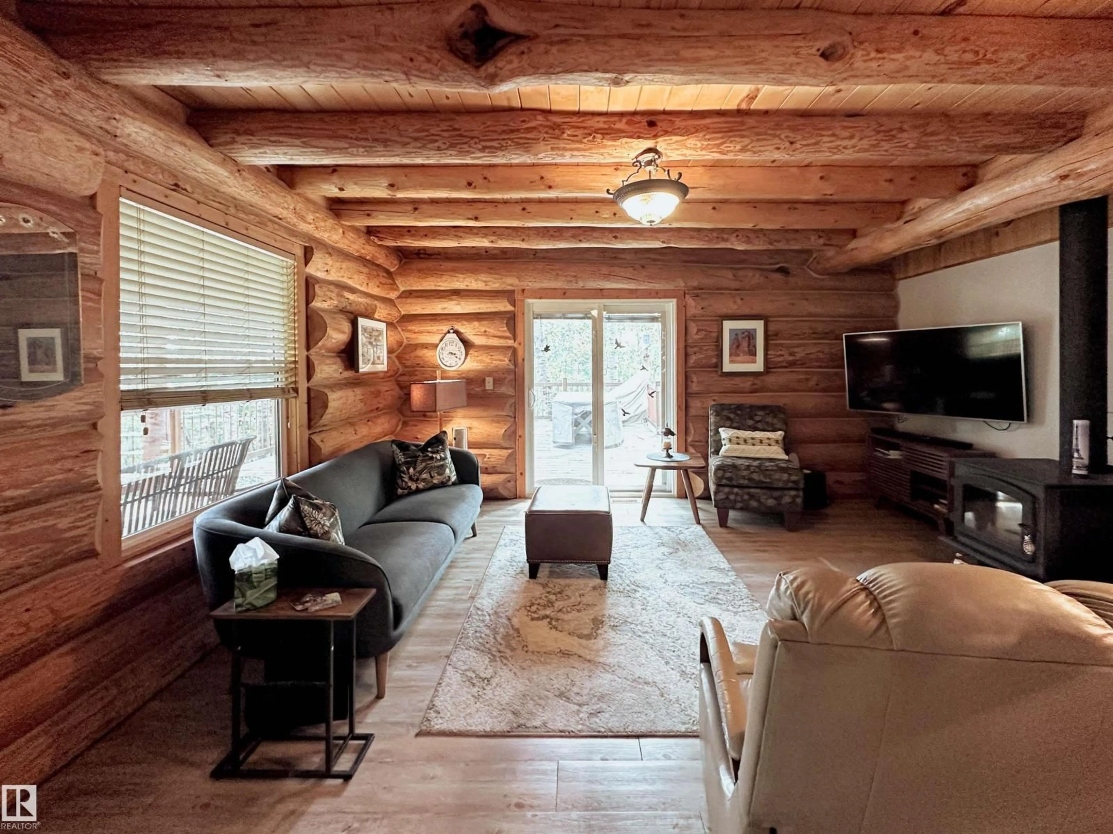 Living room with furniture, wood/laminate floor for 9000 1 AV, Rural Parkland County Alberta T0E2B0