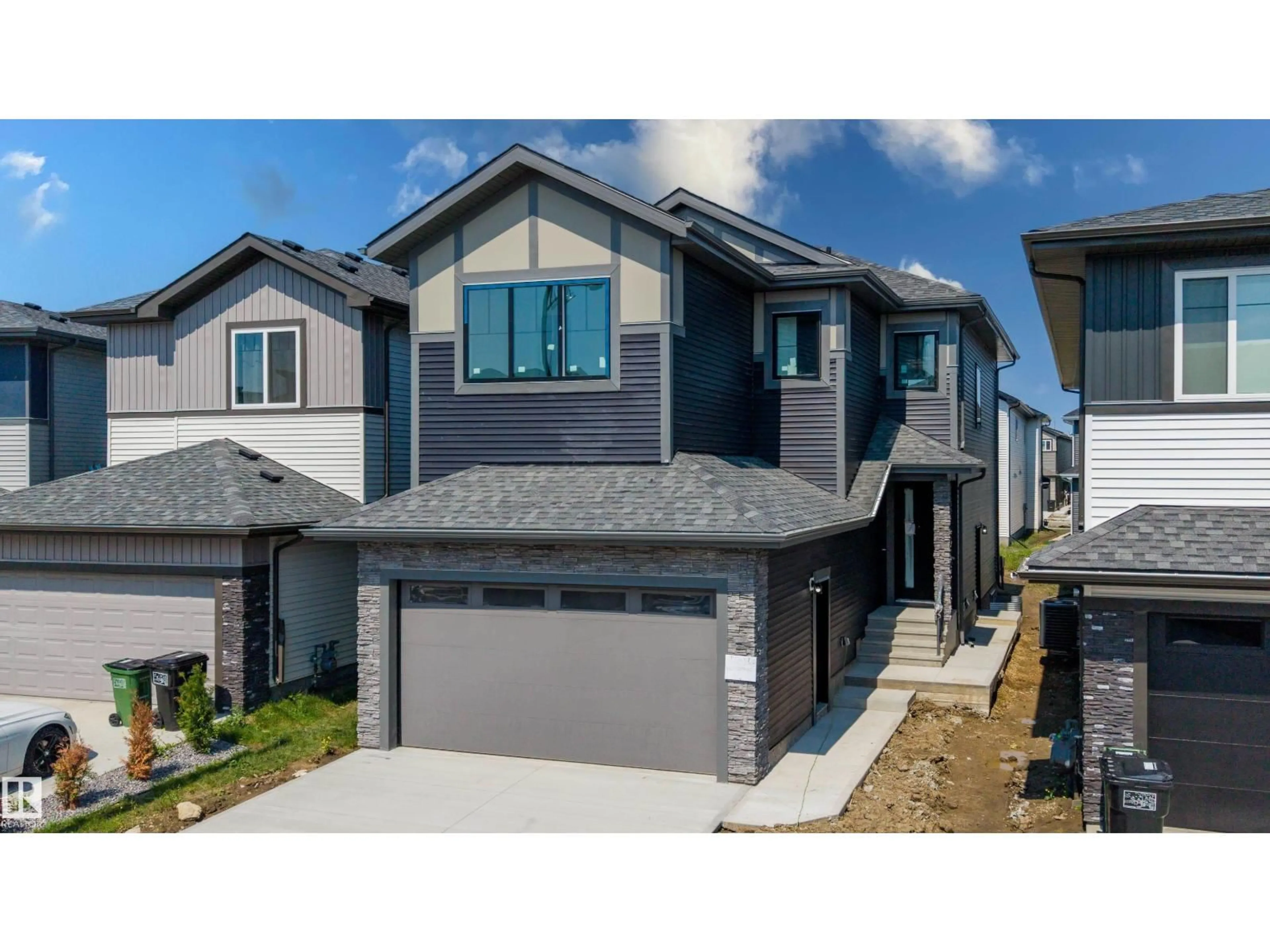 Home with vinyl exterior material, street for NW - 8728 182 AV, Edmonton Alberta T5Z2K6