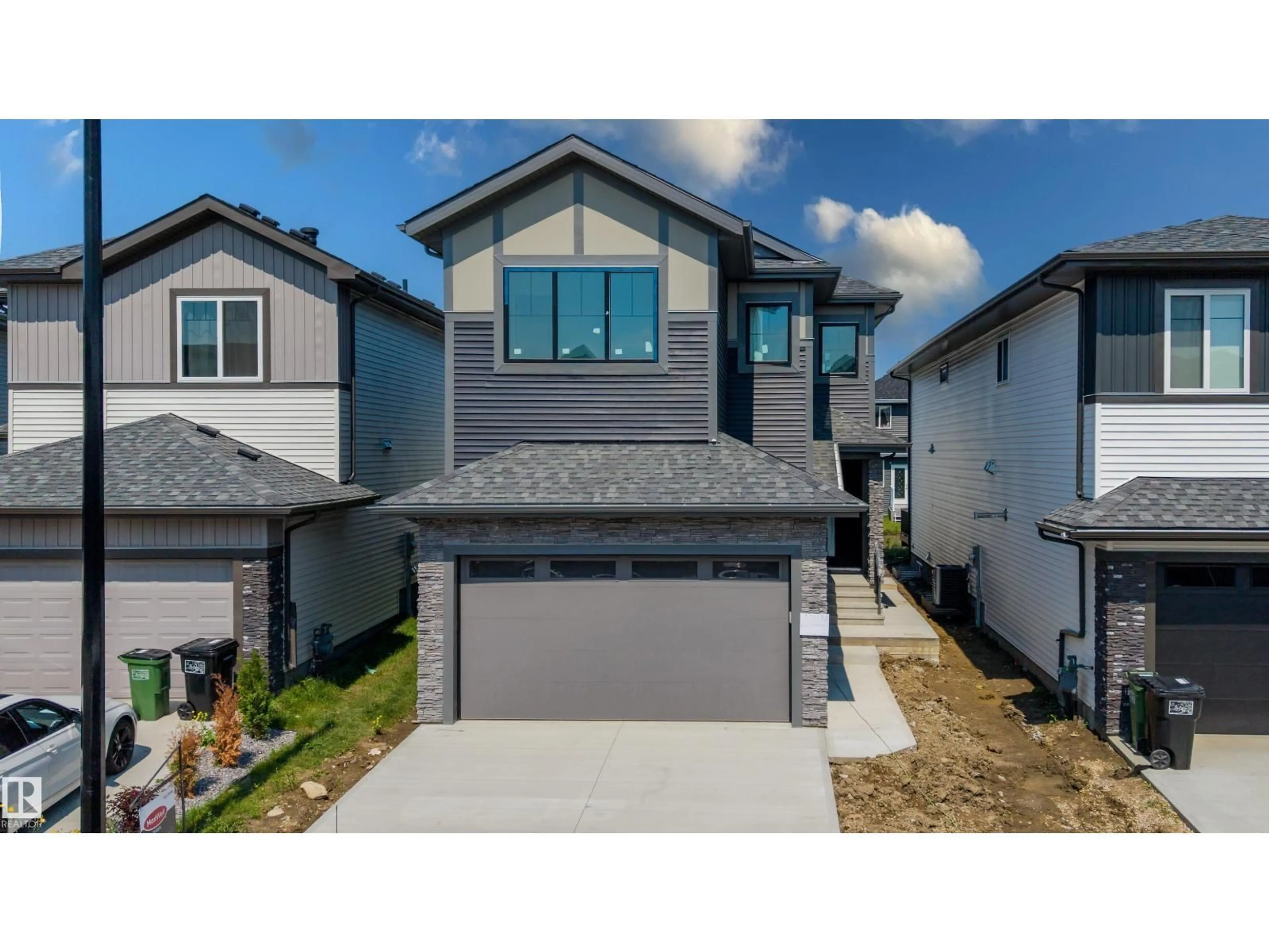 Home with vinyl exterior material, street for NW - 8728 182 AV, Edmonton Alberta T5Z2K6