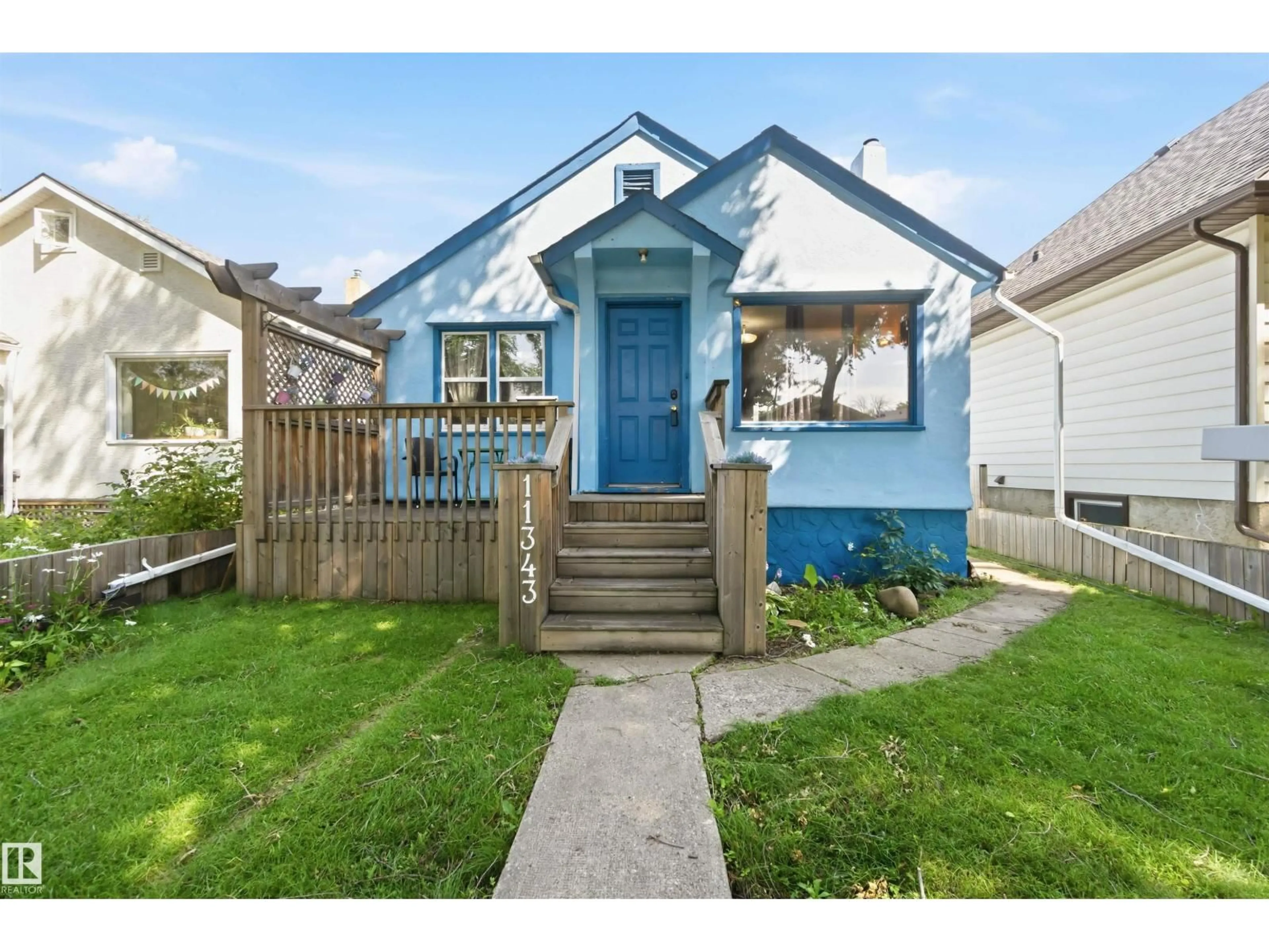 Home with vinyl exterior material, street for NW - 11343 96 ST, Edmonton Alberta T5G1T2