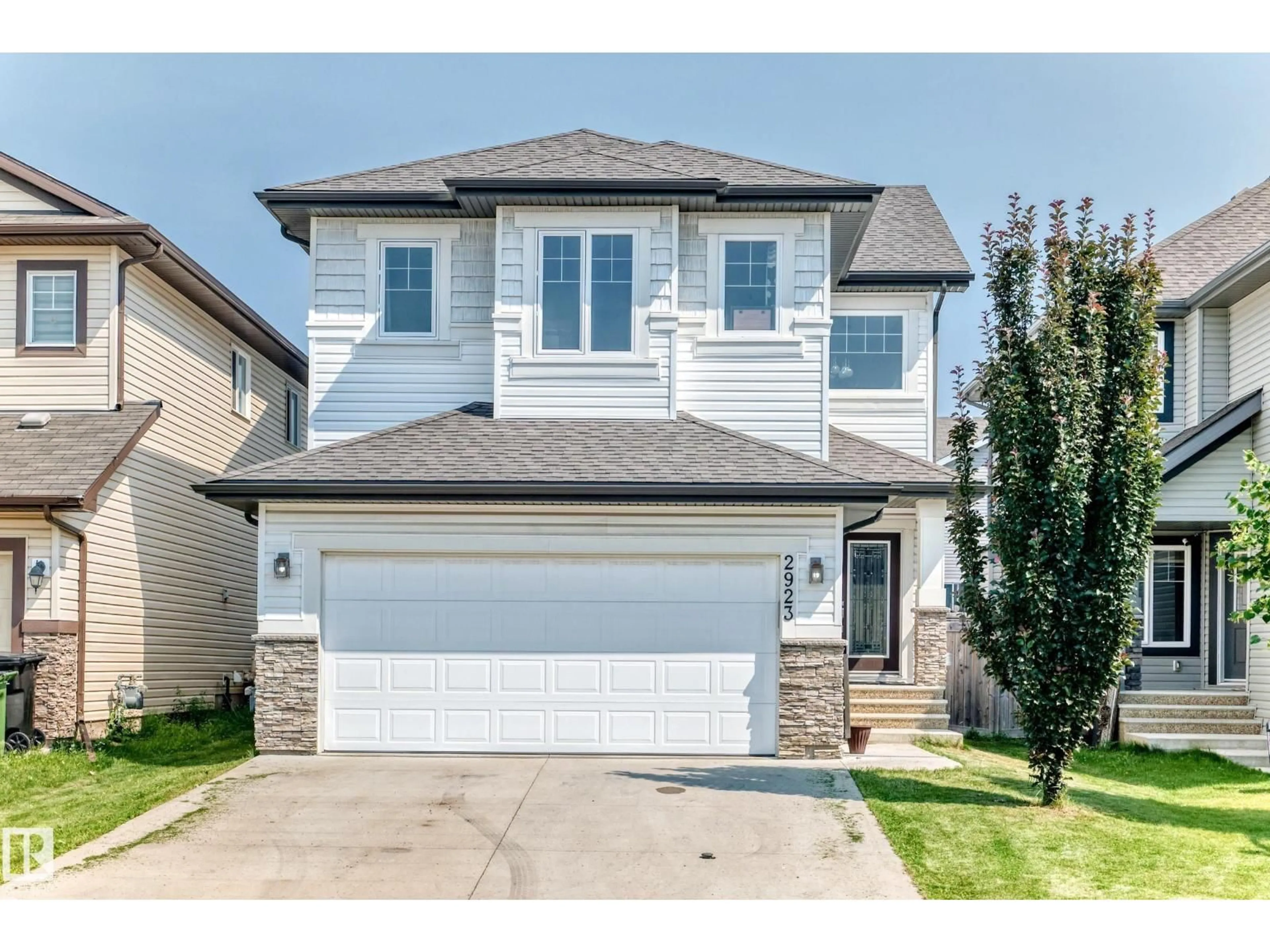 Home with vinyl exterior material, street for 2923 16 ST, Edmonton Alberta T6T0V8