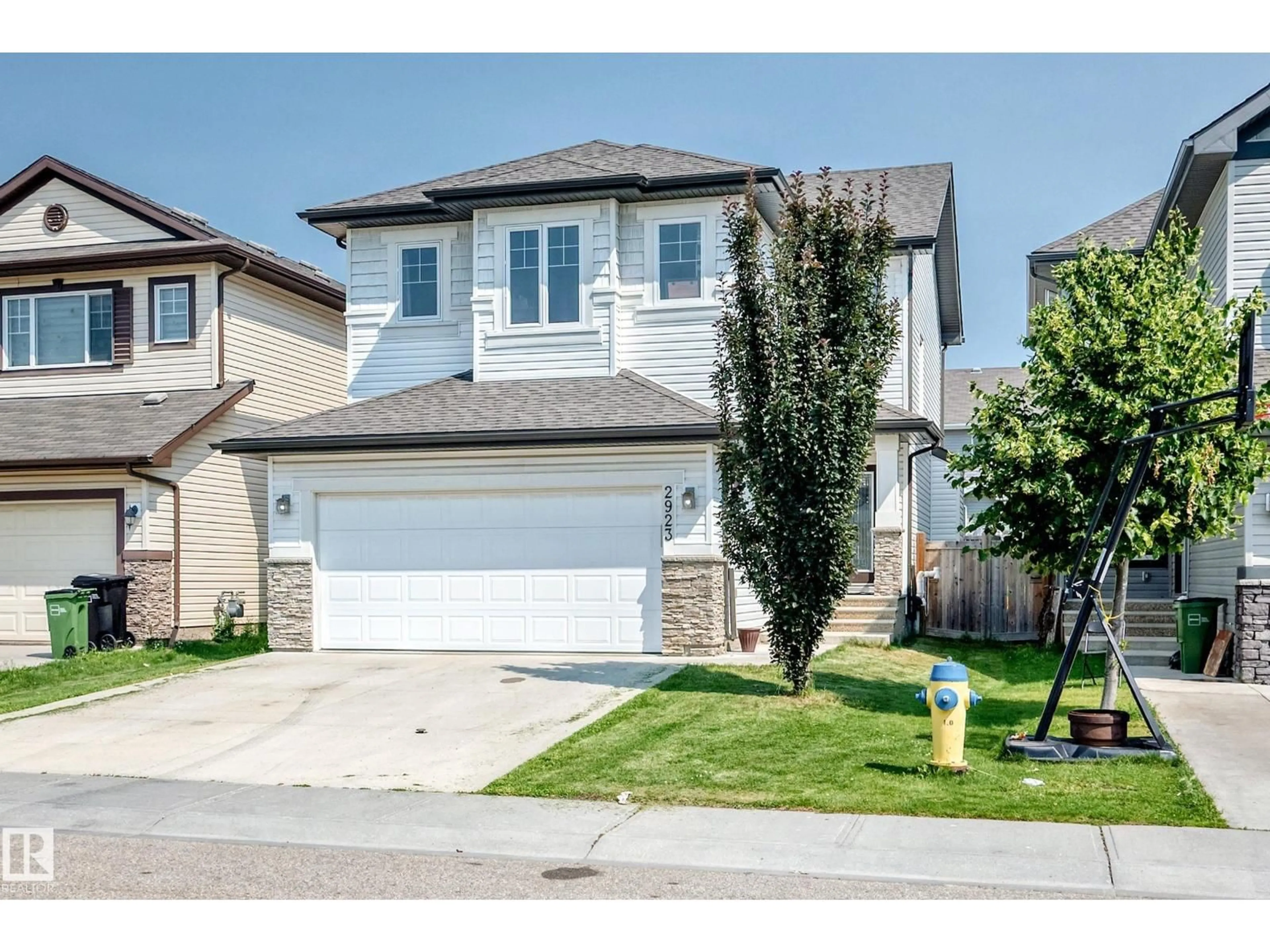 Home with vinyl exterior material, street for 2923 16 ST, Edmonton Alberta T6T0V8