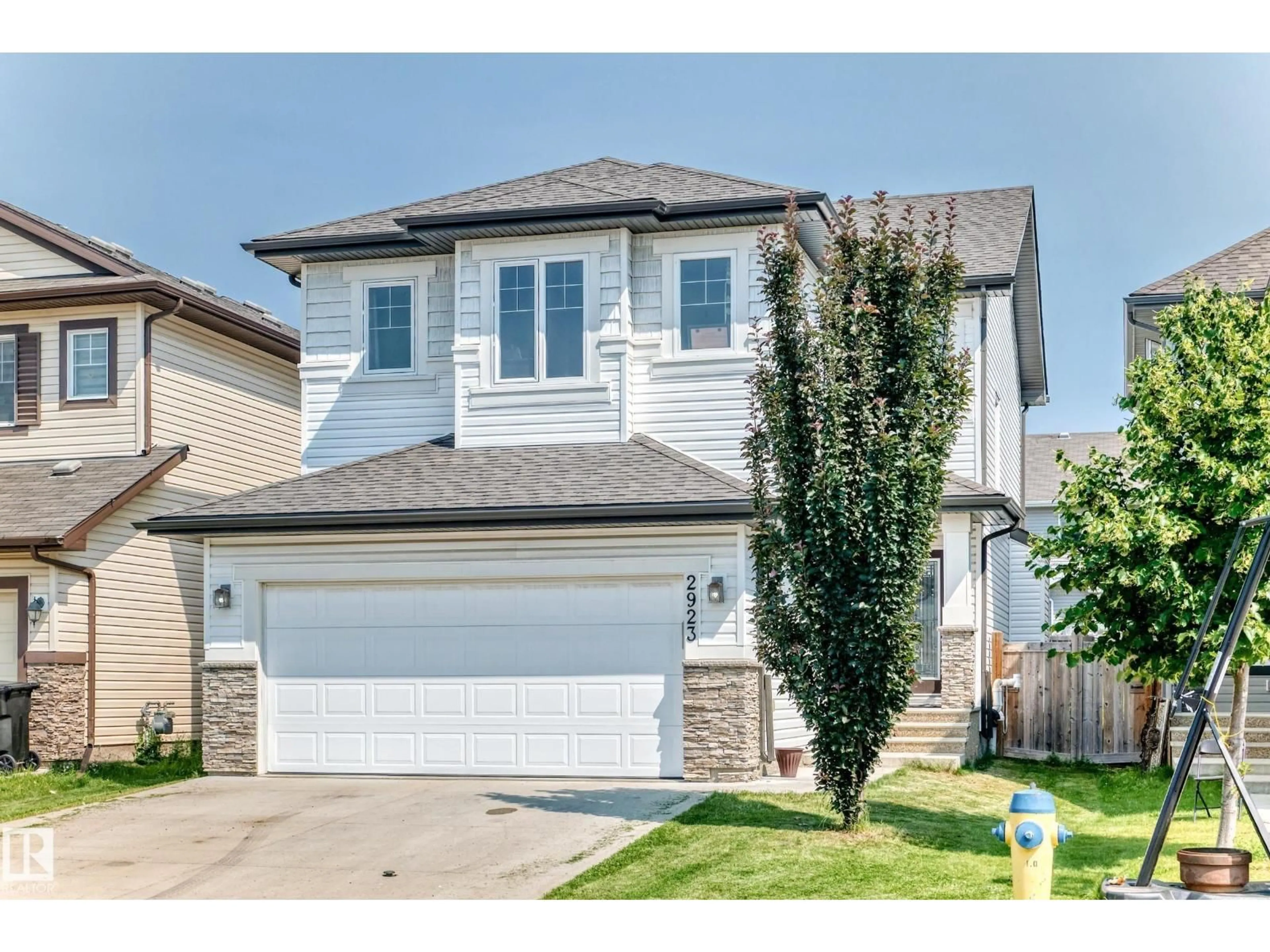 Home with vinyl exterior material, street for 2923 16 ST, Edmonton Alberta T6T0V8