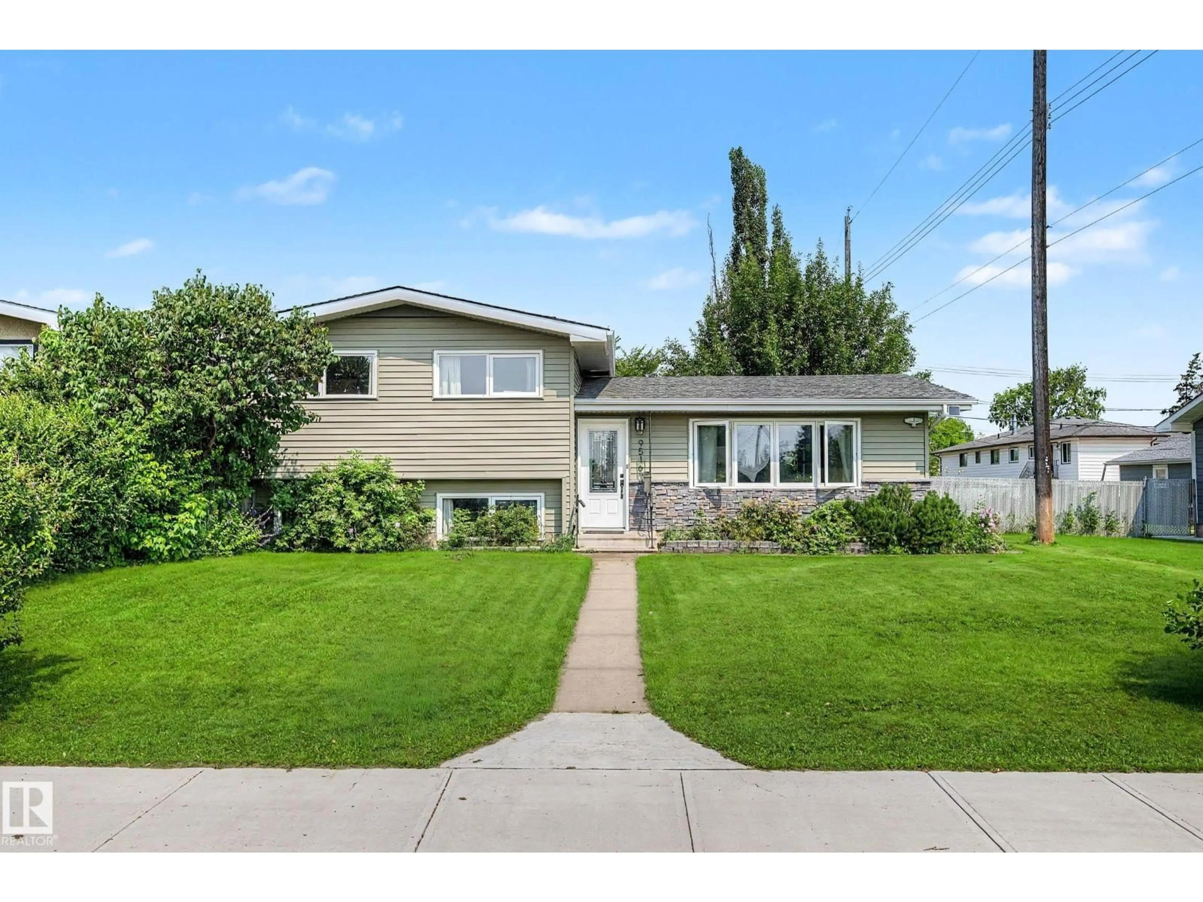 Home with vinyl exterior material, street for 9516 129A AV NW, Edmonton Alberta T5E0N8
