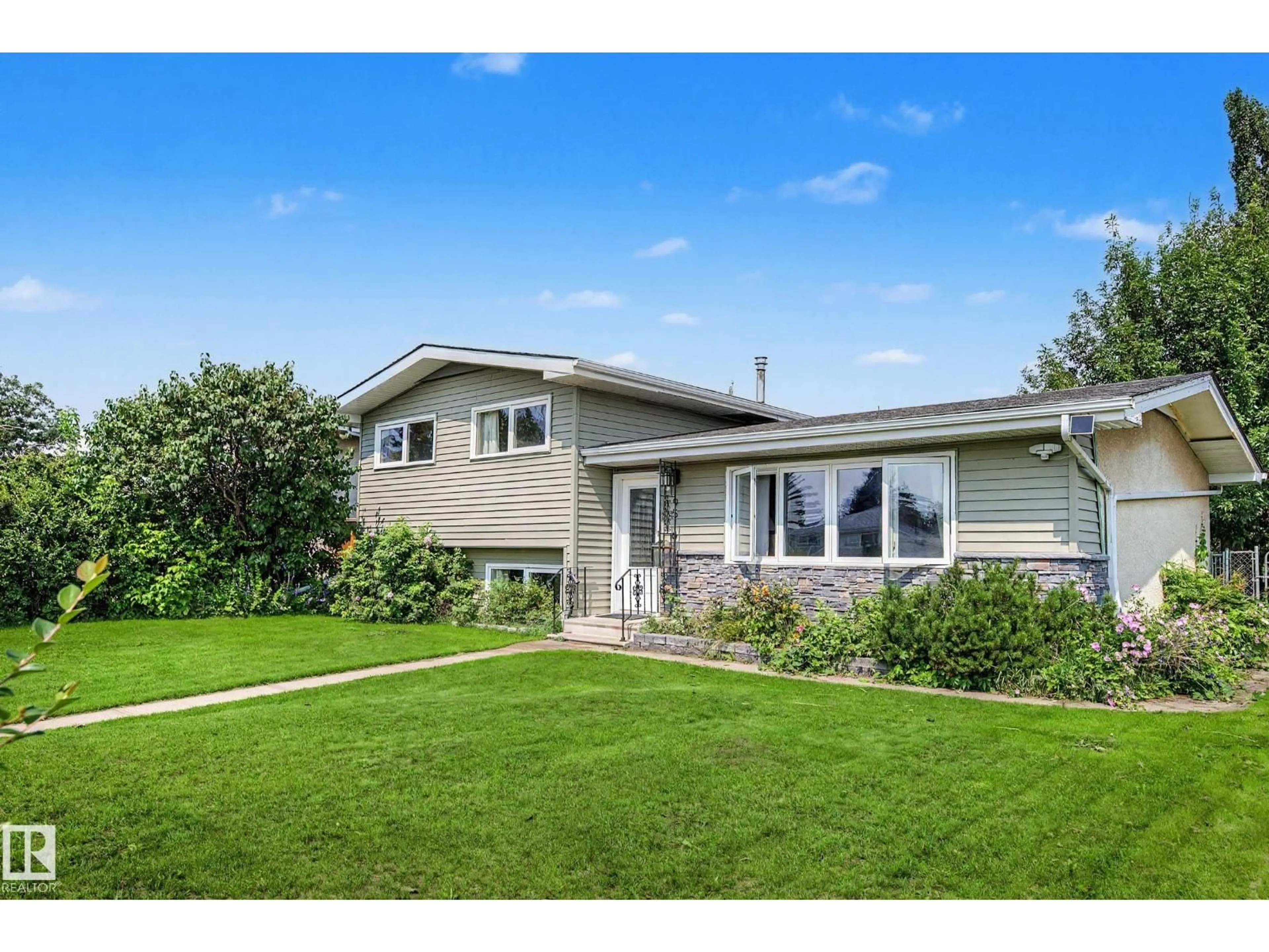 Home with vinyl exterior material, street for 9516 129A AV NW, Edmonton Alberta T5E0N8